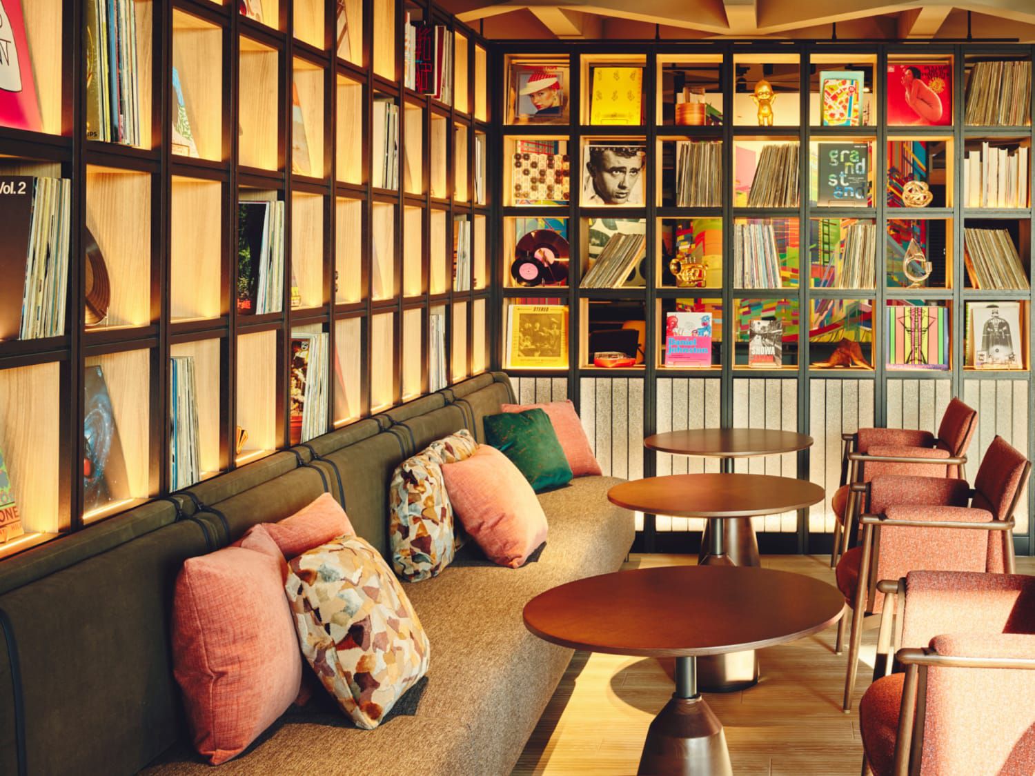 Modern common area seating space lined with vinyl record shelves