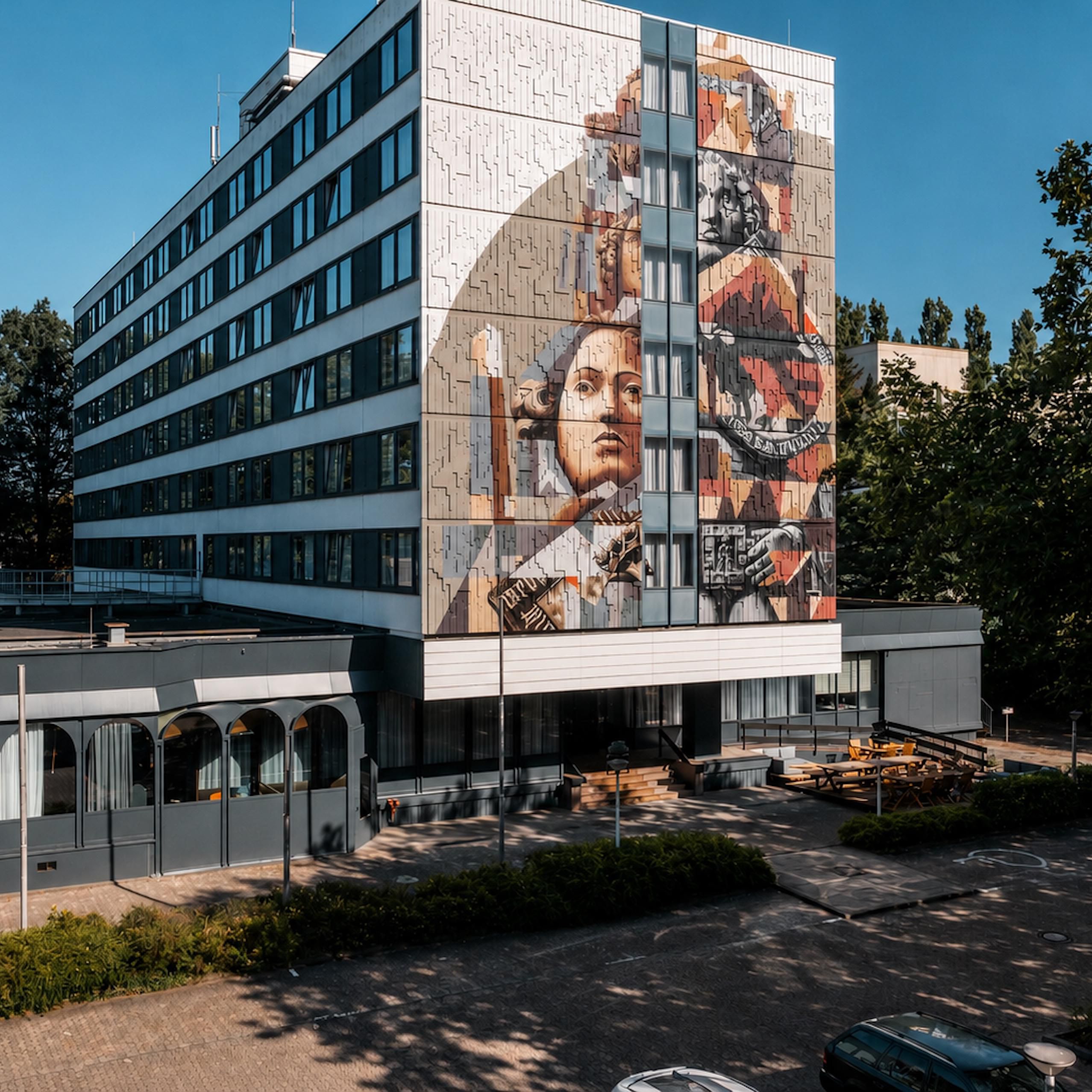 Hotel exterior and parking area in Bremen.