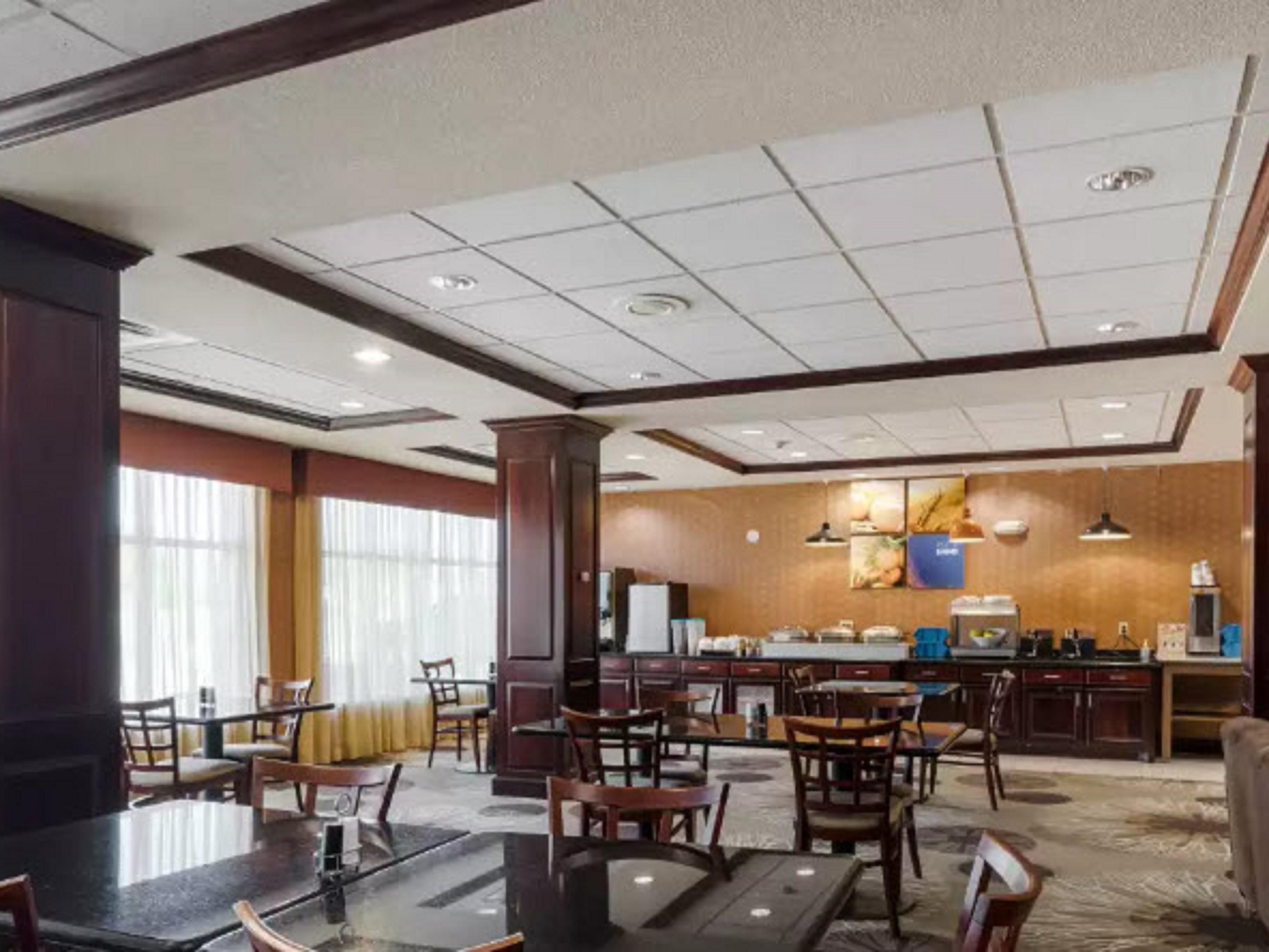  Start your day with a free, hot breakfast, featuring items like eggs, bacon or sausage, pancakes, yogurt, fruit, and a variety of beverages such as coffee and juices.