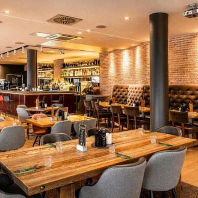 Restaurant with bar and sitting area 