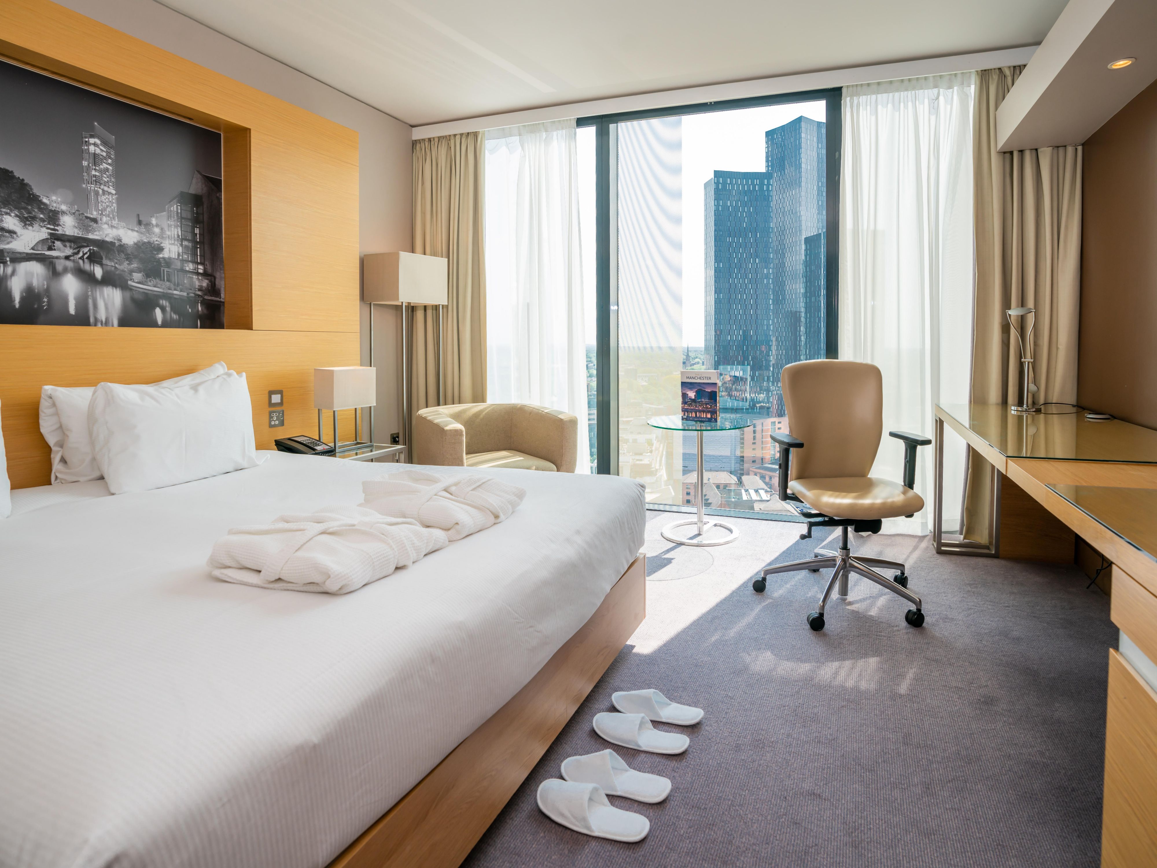 standard guest room with amenities like slippers and dressing gown