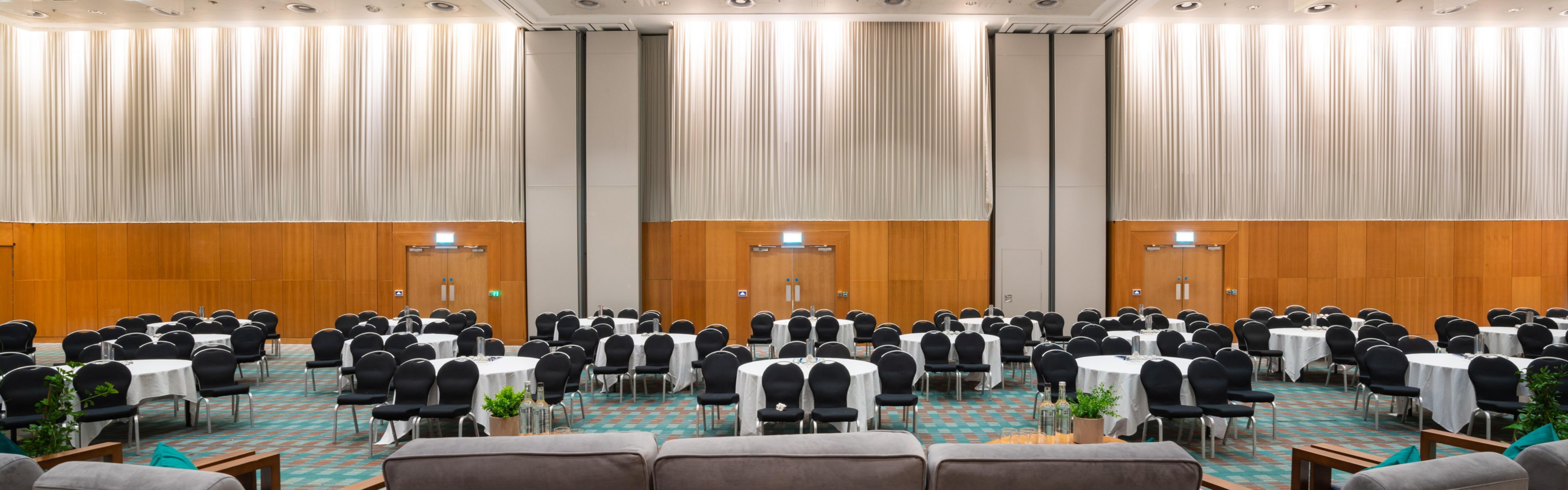 Large event space with red low lighting