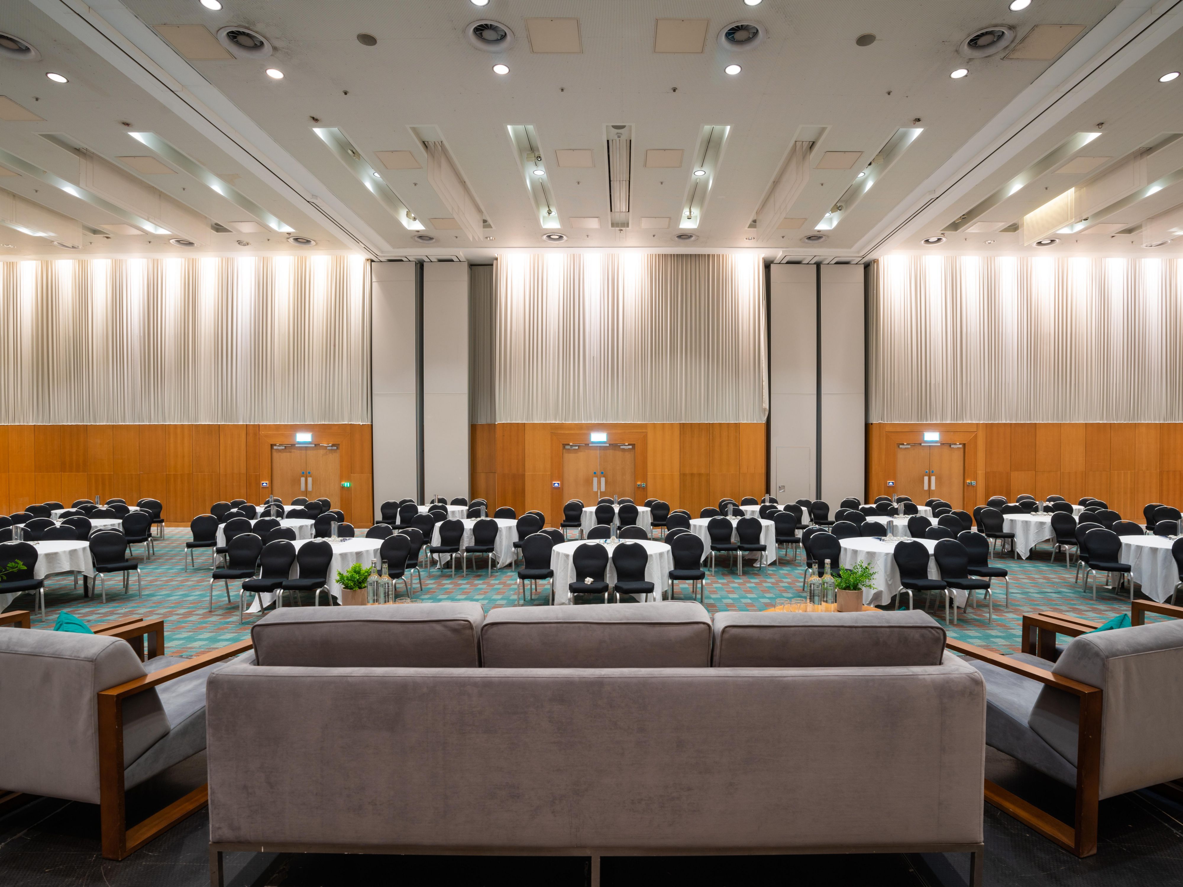 Large conference meeting room with sofas and chairs