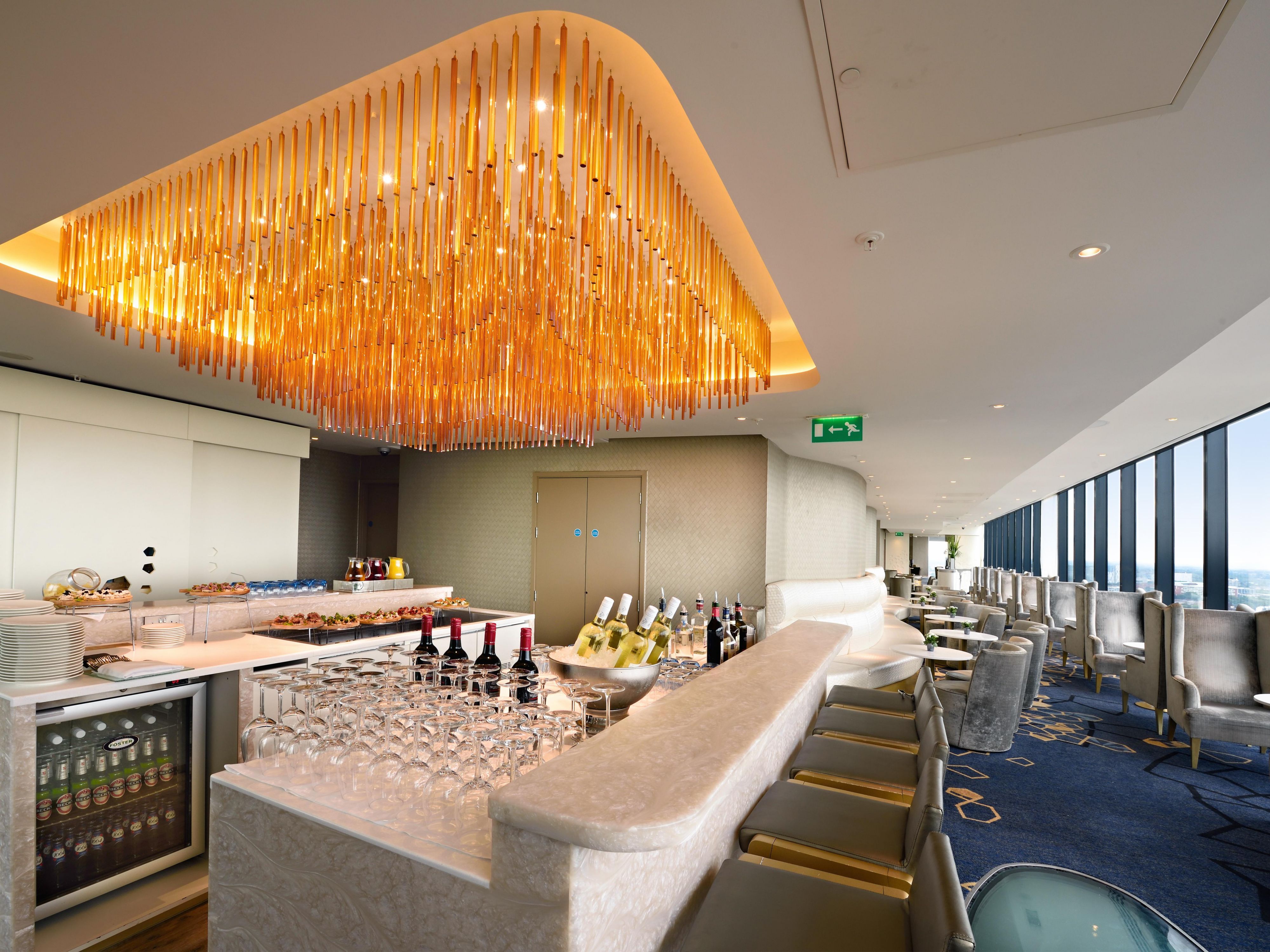 Club Lounge bar and seating area with skyline views