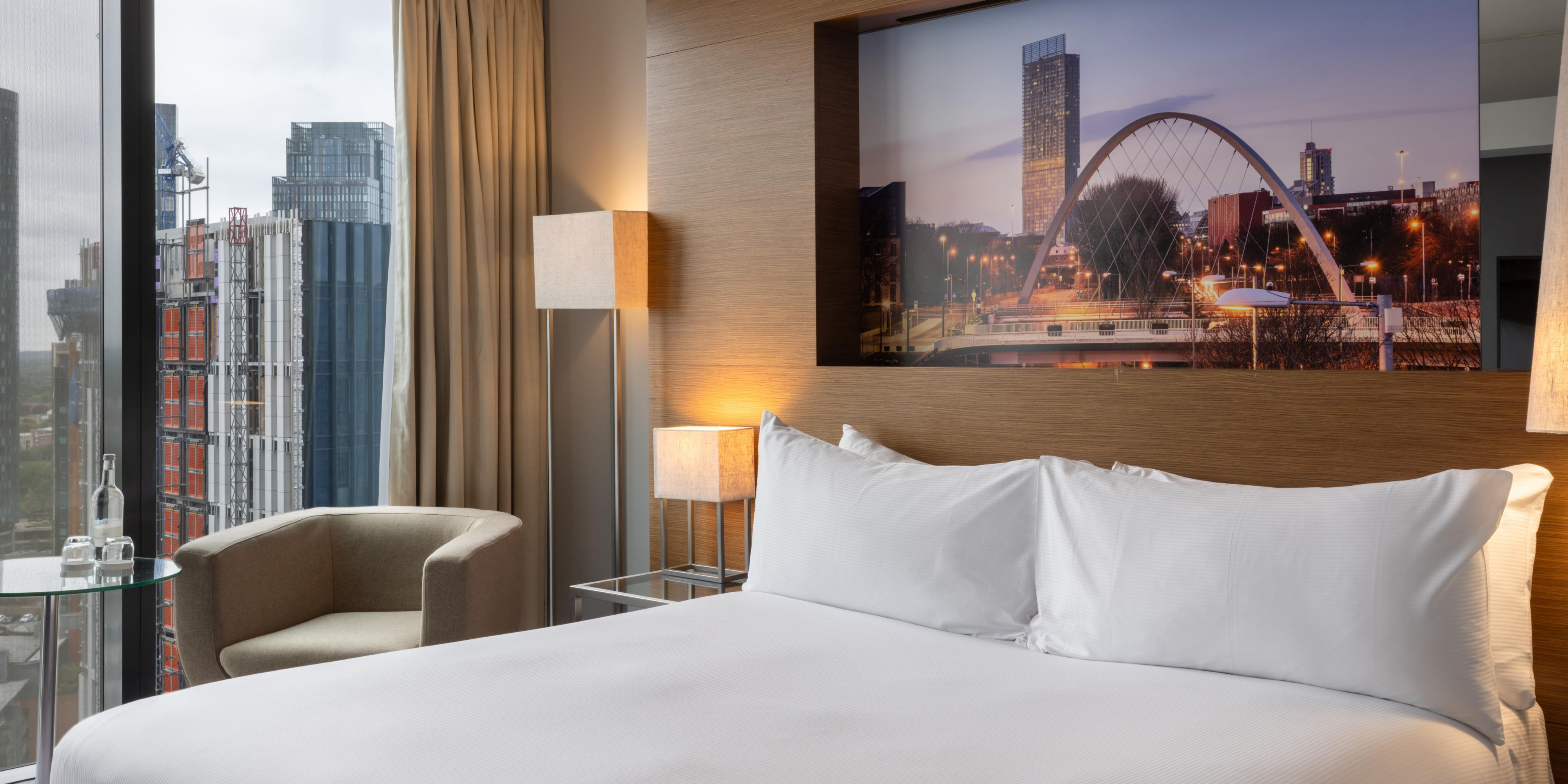 Queen size hotel guest room with manchester views
