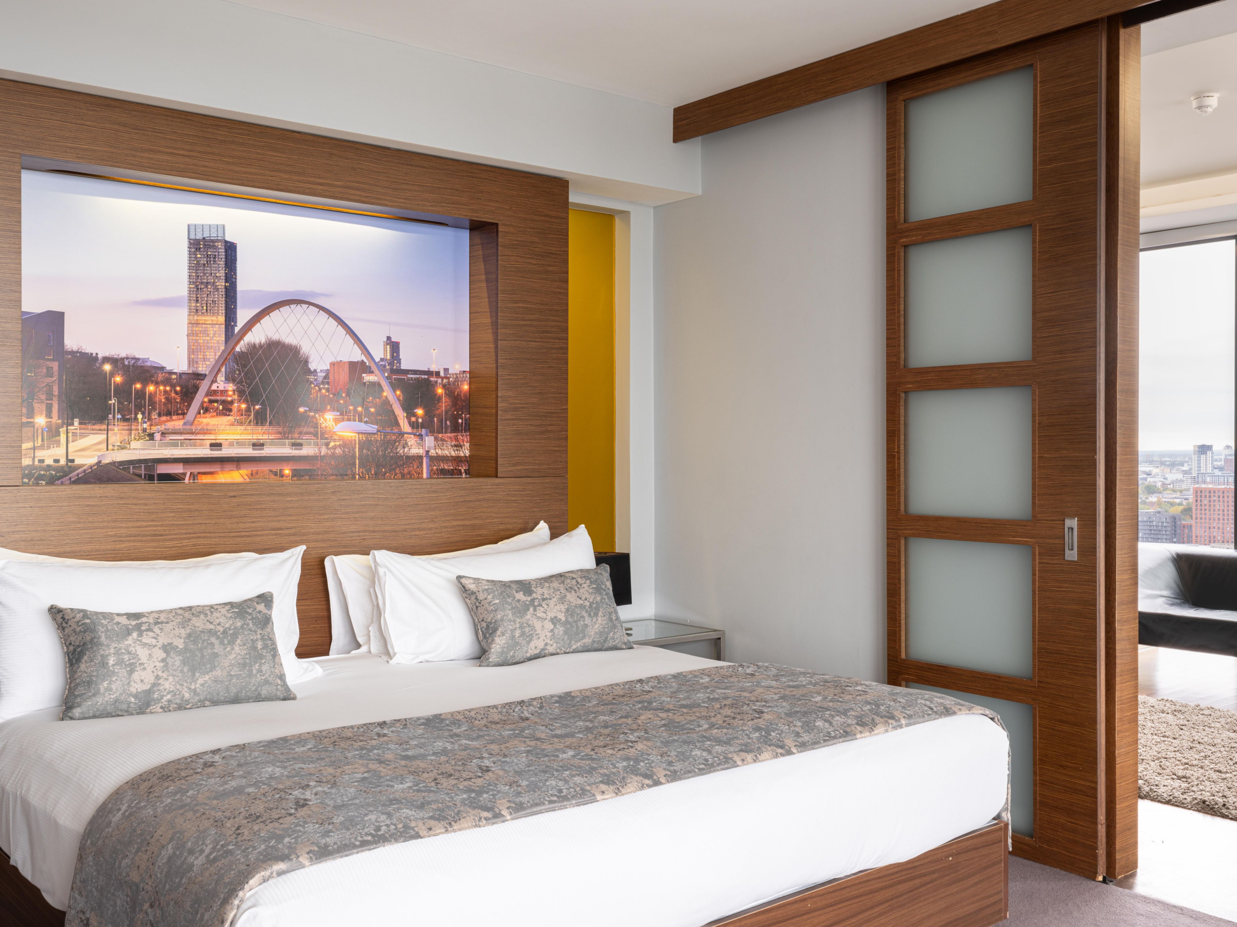 Our suites offer a luxurious and spacious setting in the heart of Manchester. Each room features a king bed, separate living and entertainment areas, and a walk-in shower with a separate bath. Located on a high floor, guests also enjoy exclusive Club Lounge access, complete with complimentary snacks and beverages.