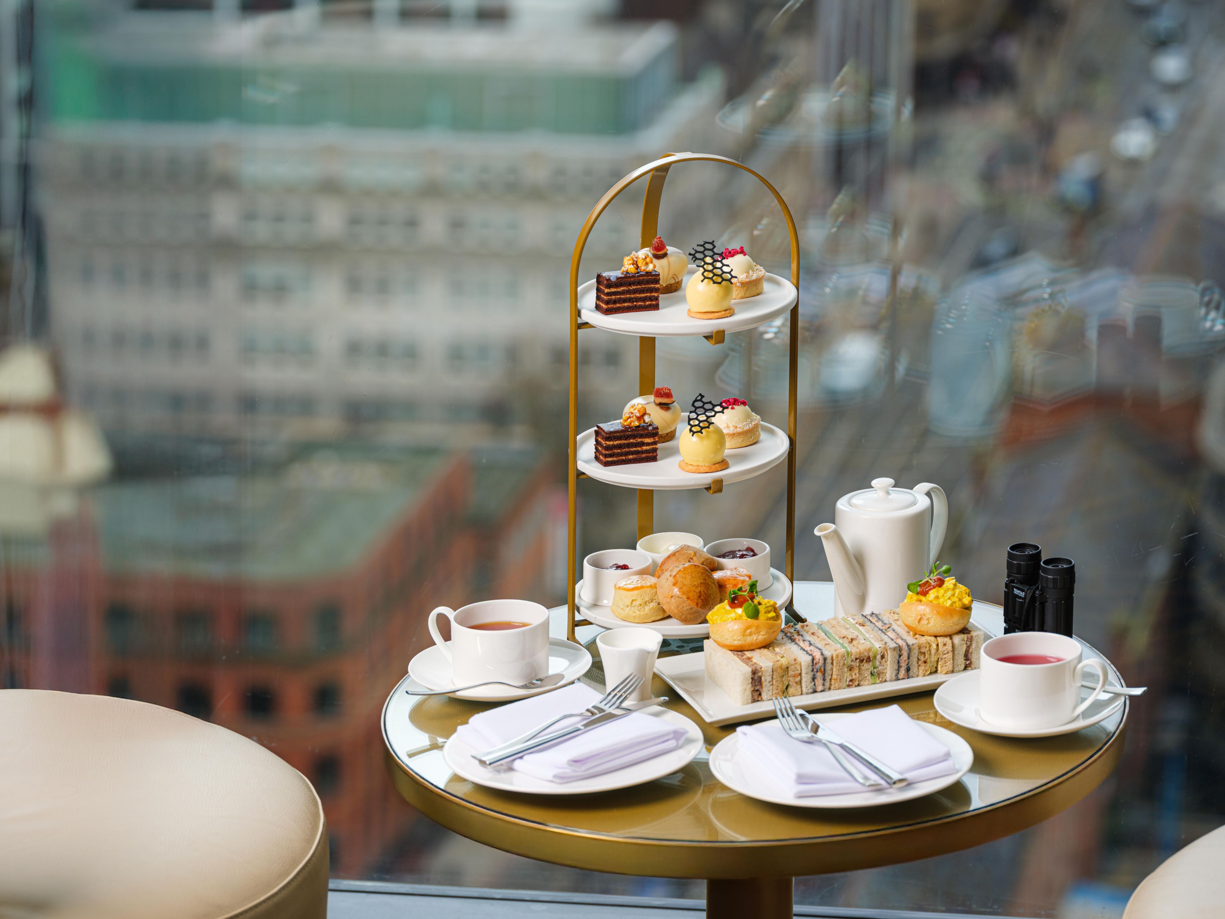 afternoon tea with skyline view and sweet treat delights