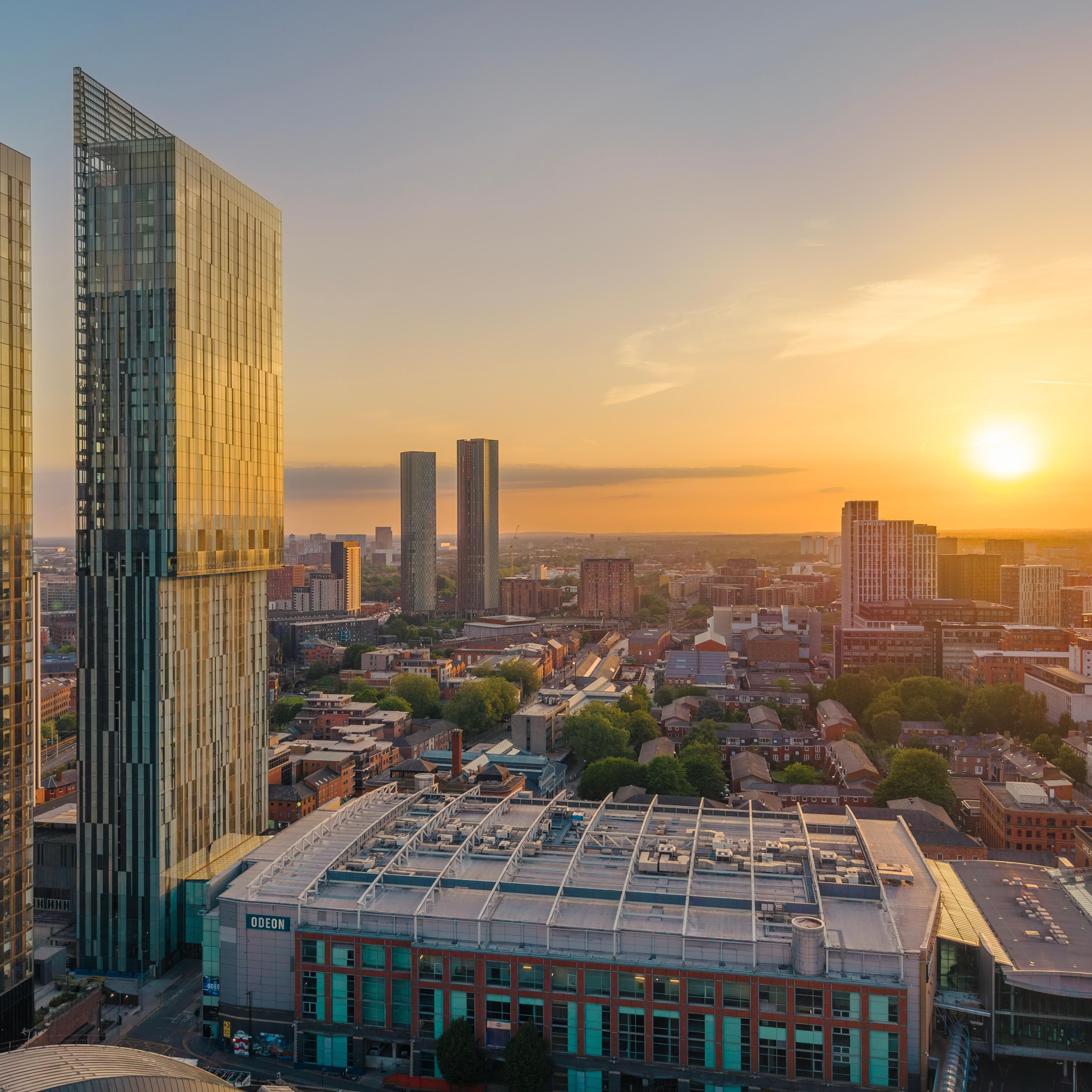 Golden hour skyline from The Manchester Deansgate hotel in city ce
