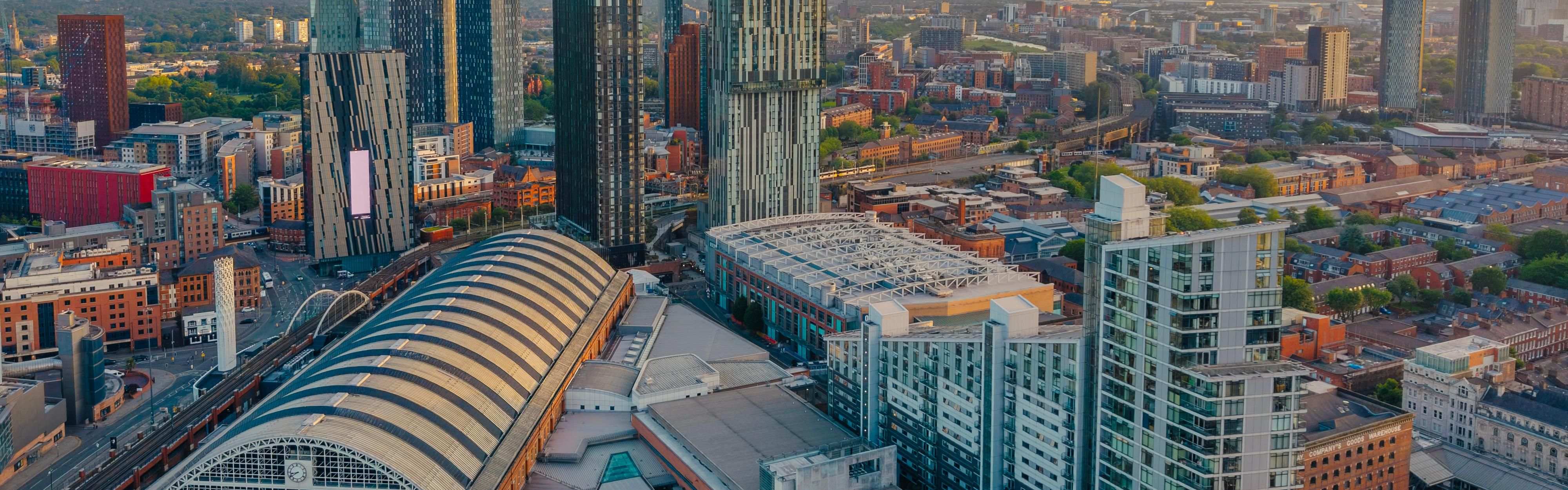 Skyline views from The Manchester Deansgate hotel at sunset glow