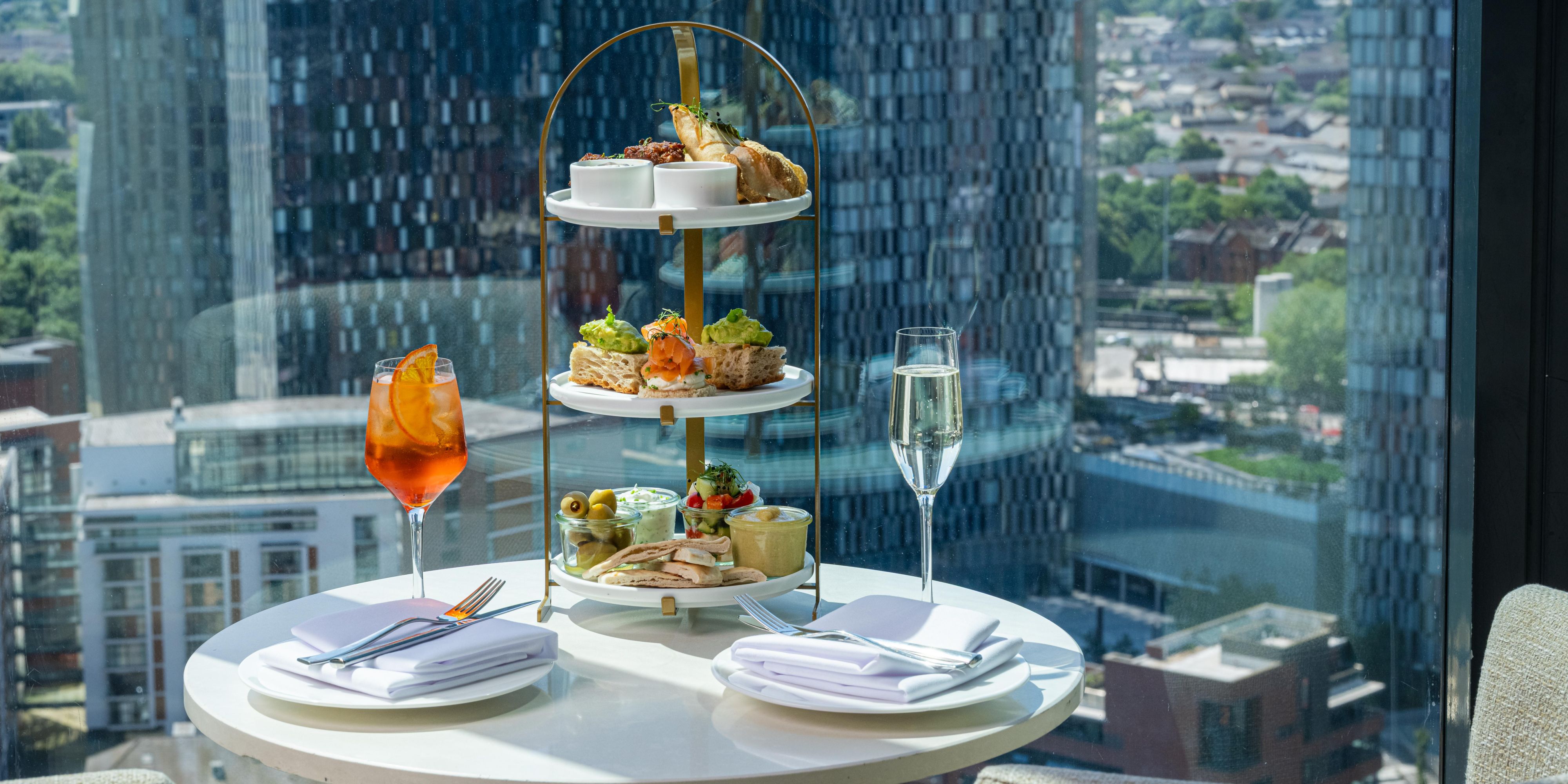 afternoon tea with an aperol sprtz and glass of prosecco