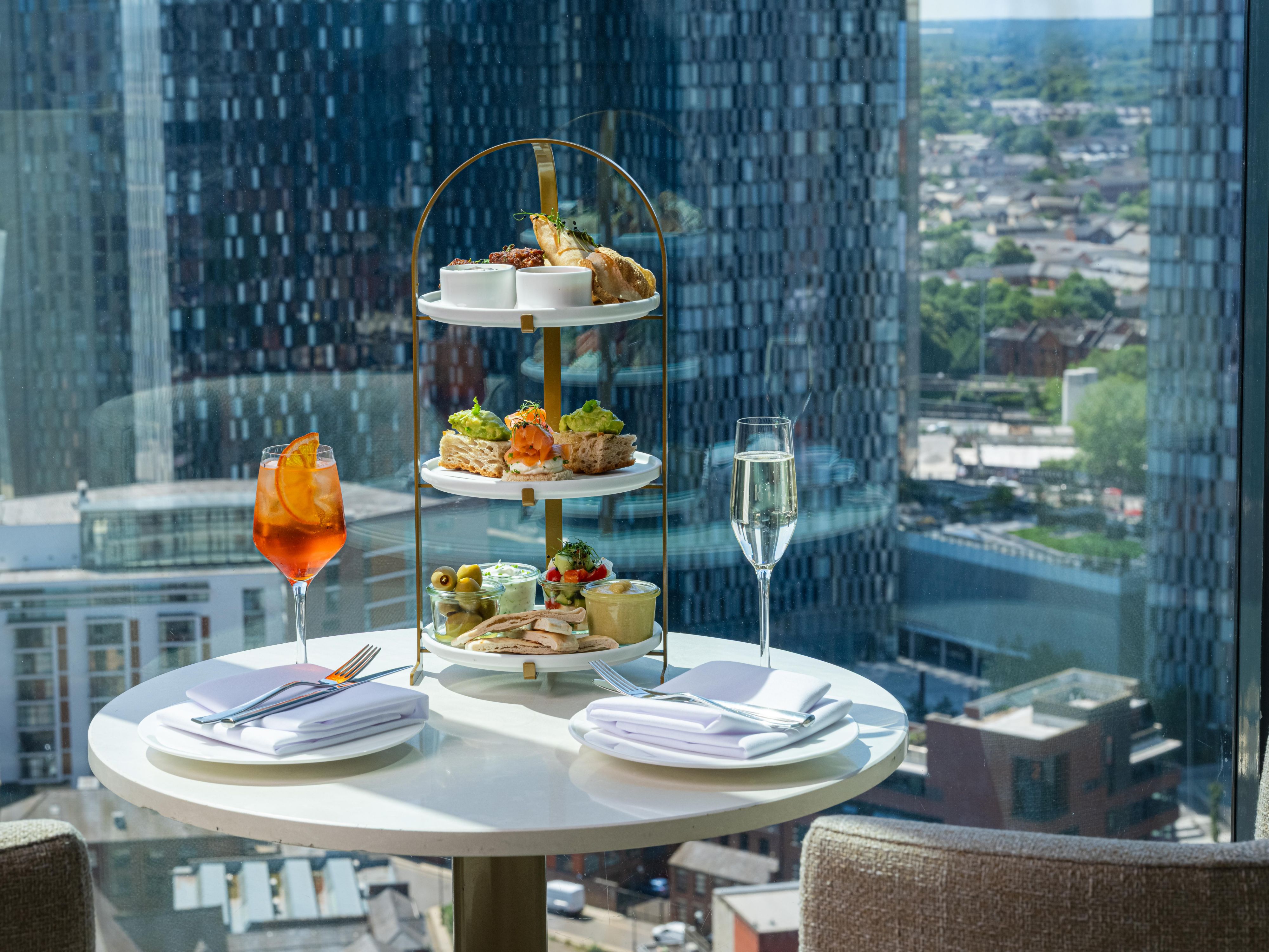 afternoon tea with aperol spritz, prosecco and sky high views