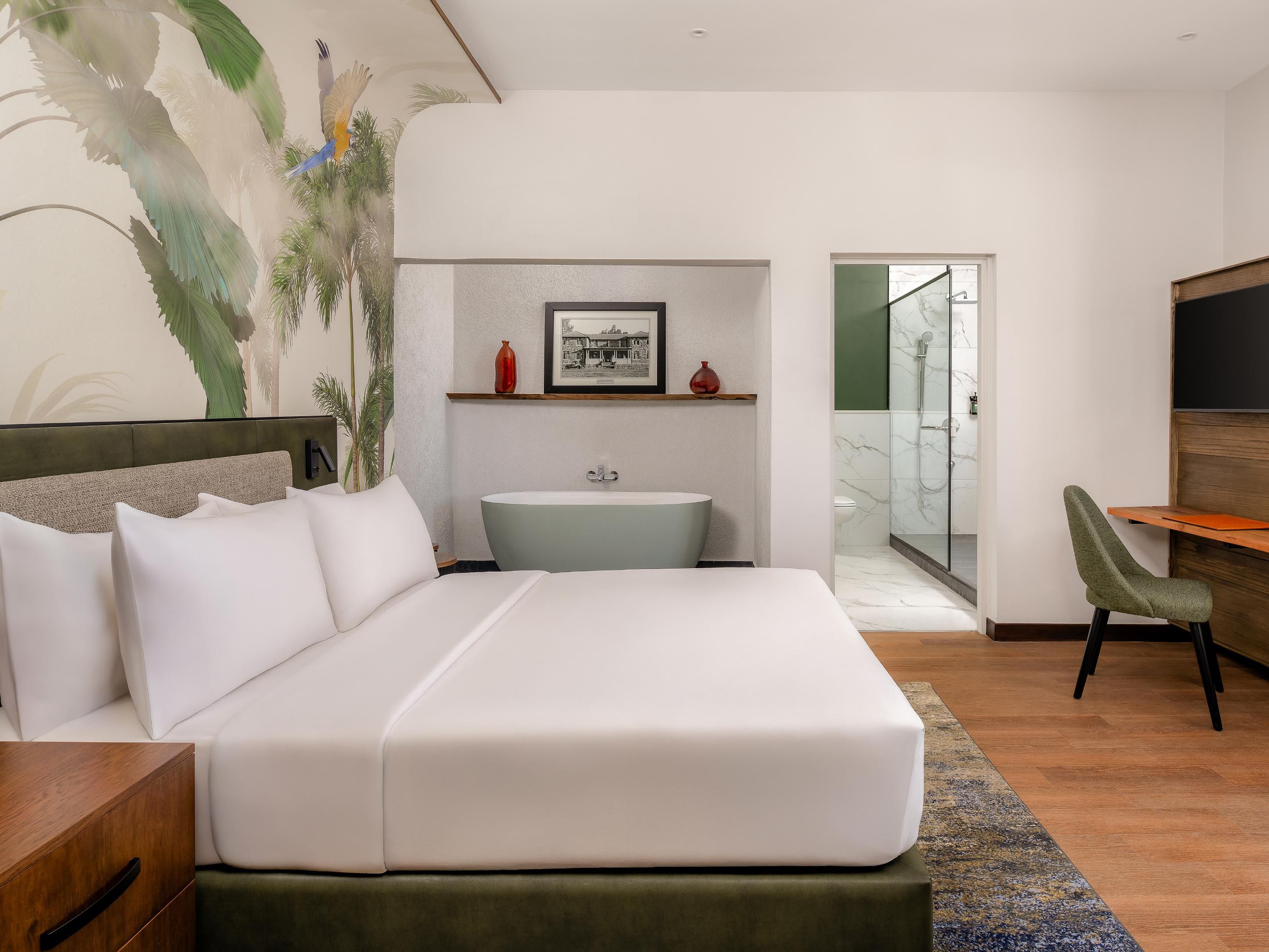 Relax in generously sized rooms featuring queen or twin beds, designed for rest and productivity. Choose between refreshing showers or relaxing bathtubs. Our rooms and suites are carefully designed to provide a seamless experience for all our guests.