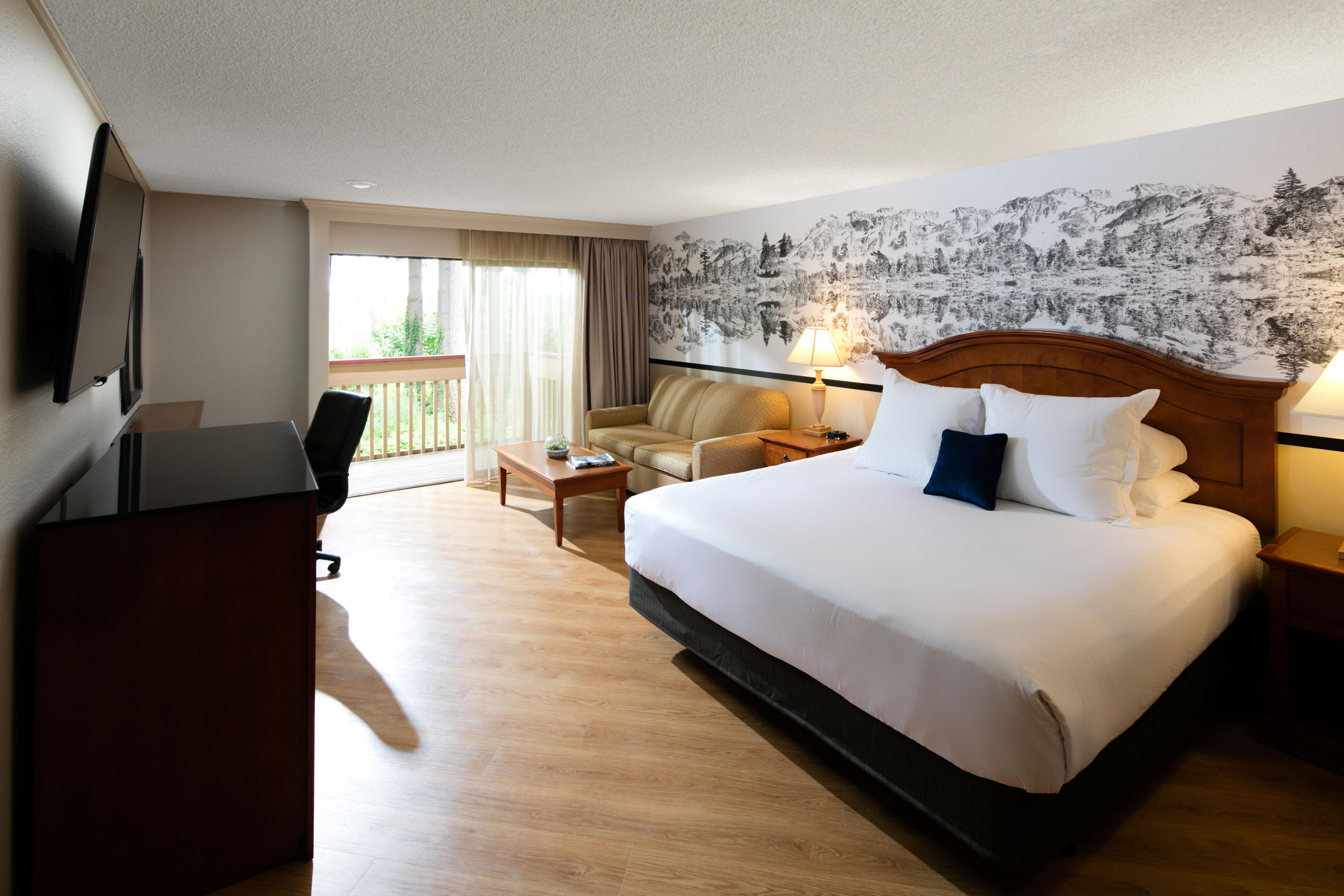 Rooms feature plush bedding with fresh linens and charming views of Capitol Lake and its natural beauty. Enjoy modern amenities, such as a flat-screen TV, and take advantage of options to upgrade to a suite with jacuzzi tubs and balconies overlooking the lake. The hotel's spacious rooms provide everything you need for a perfect night's sleep. 

