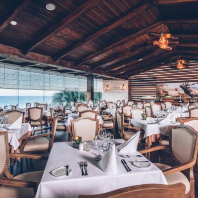 Nicely decorated tables and chairs arranged in a dining area.