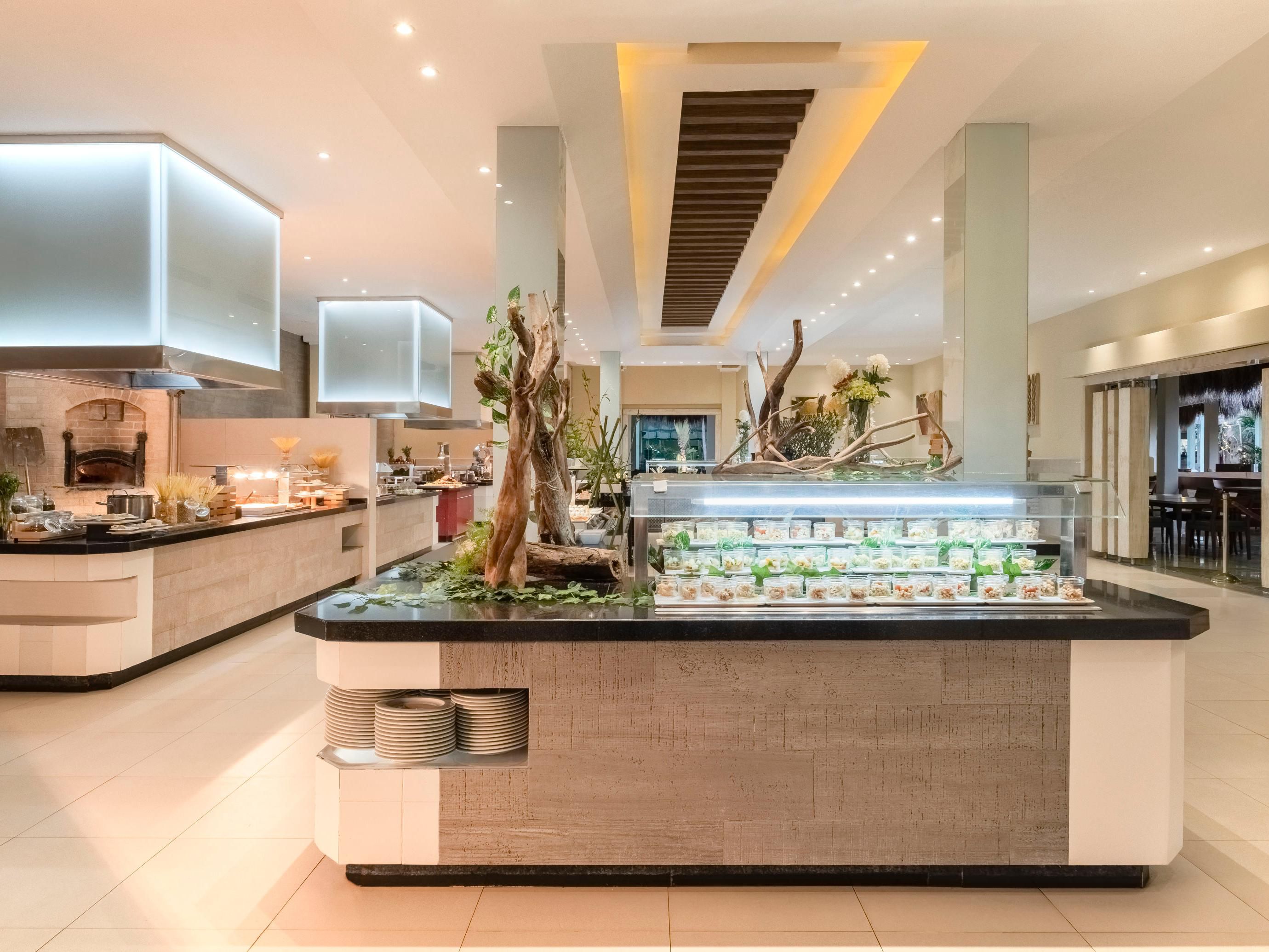 Embark on a culinary journey with the artistry of Japanese cuisine, savory delights from the smokehouse, vibrant Mexican flavors, and authentic Italian dishes, before you traverse the Mediterranean palate—all within our five themed restaurants. Casual diners can explore our buffet or grab a quick bite at the snack bar.