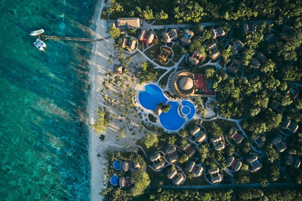 Aerial resort view  of hotel, pool and beach in Mexico