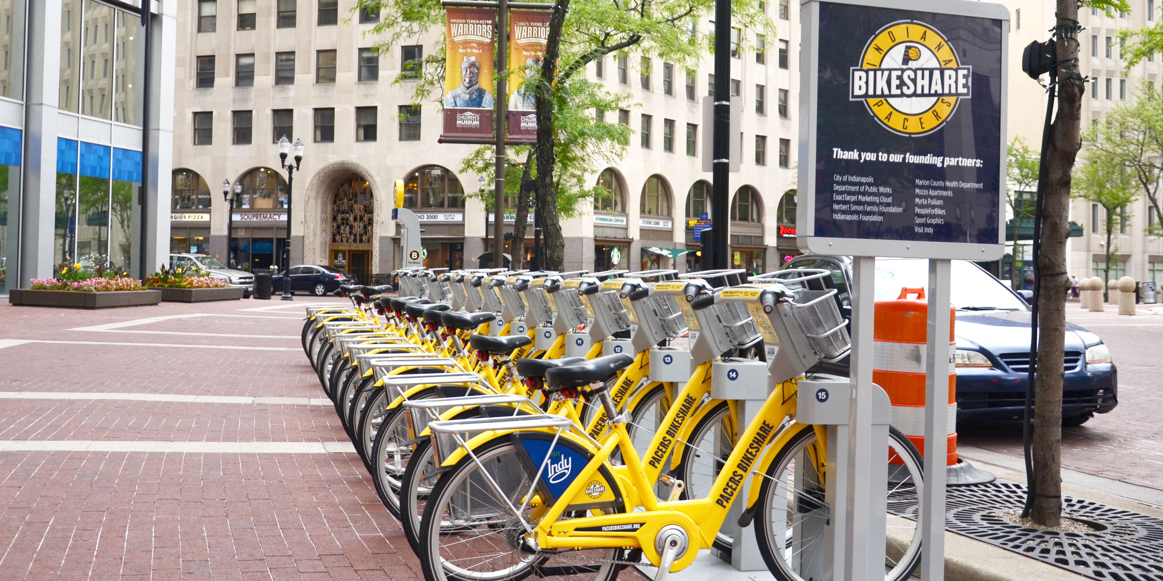 Bright yellow bike-share bicycles in downtown Indianapolis.
