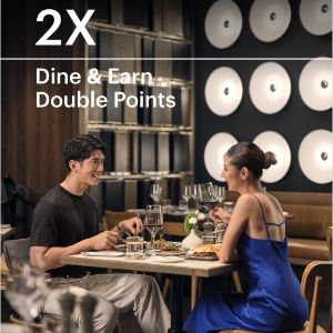 Couple enjoying restaurant dining with double rewards promotion