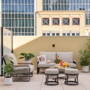 Modern rooftop terrace with comfortable outdoor lounge seating