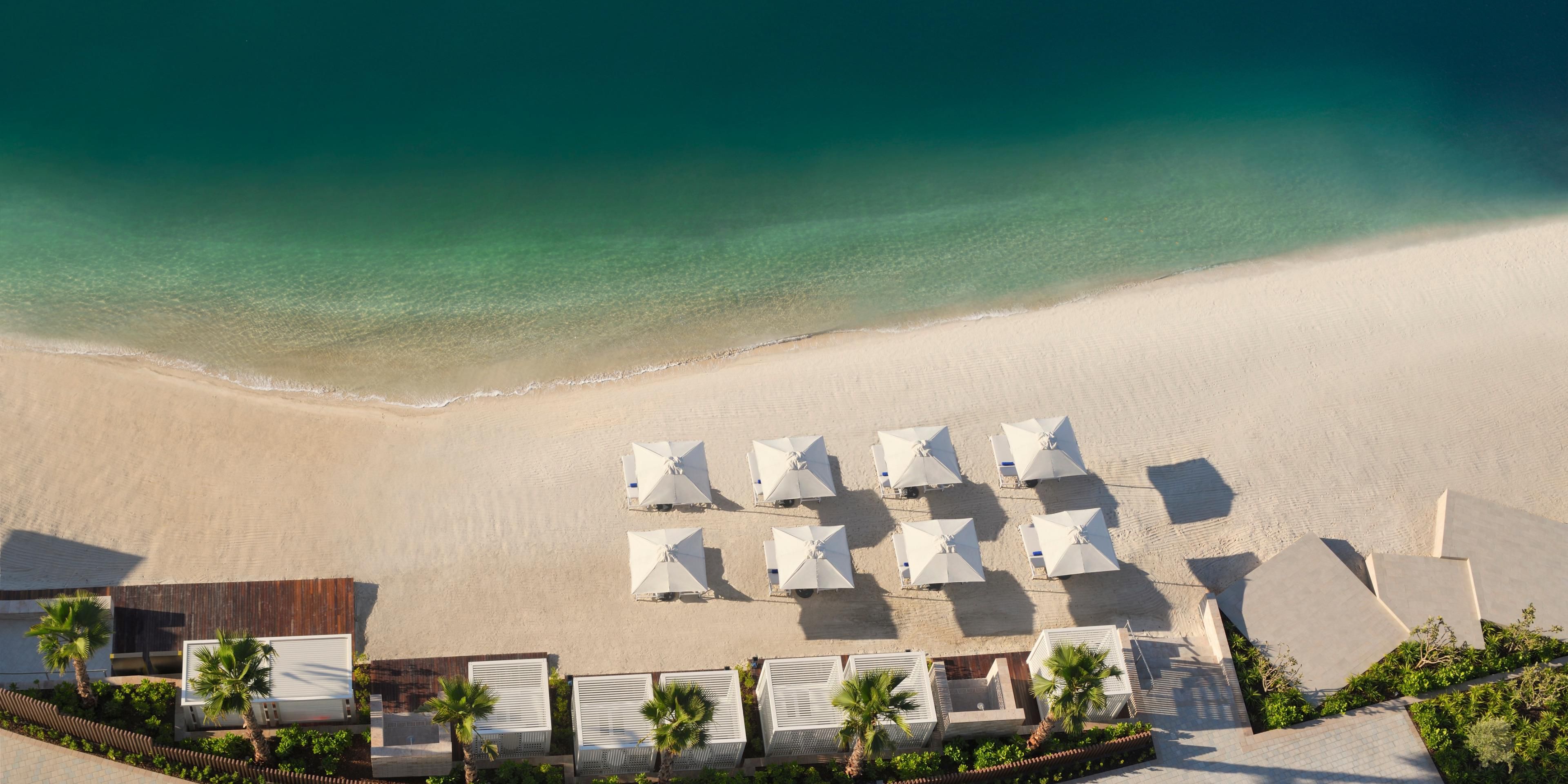 Escape to the serene private beach at InterContinental Residences Abu Dhabi, where pristine sands meet the sparkling waters of the Arabian Gulf. This exclusive beachfront offers a tranquil retreat for guests to unwind, soak up the sun, and enjoy the gentle sea breeze. 