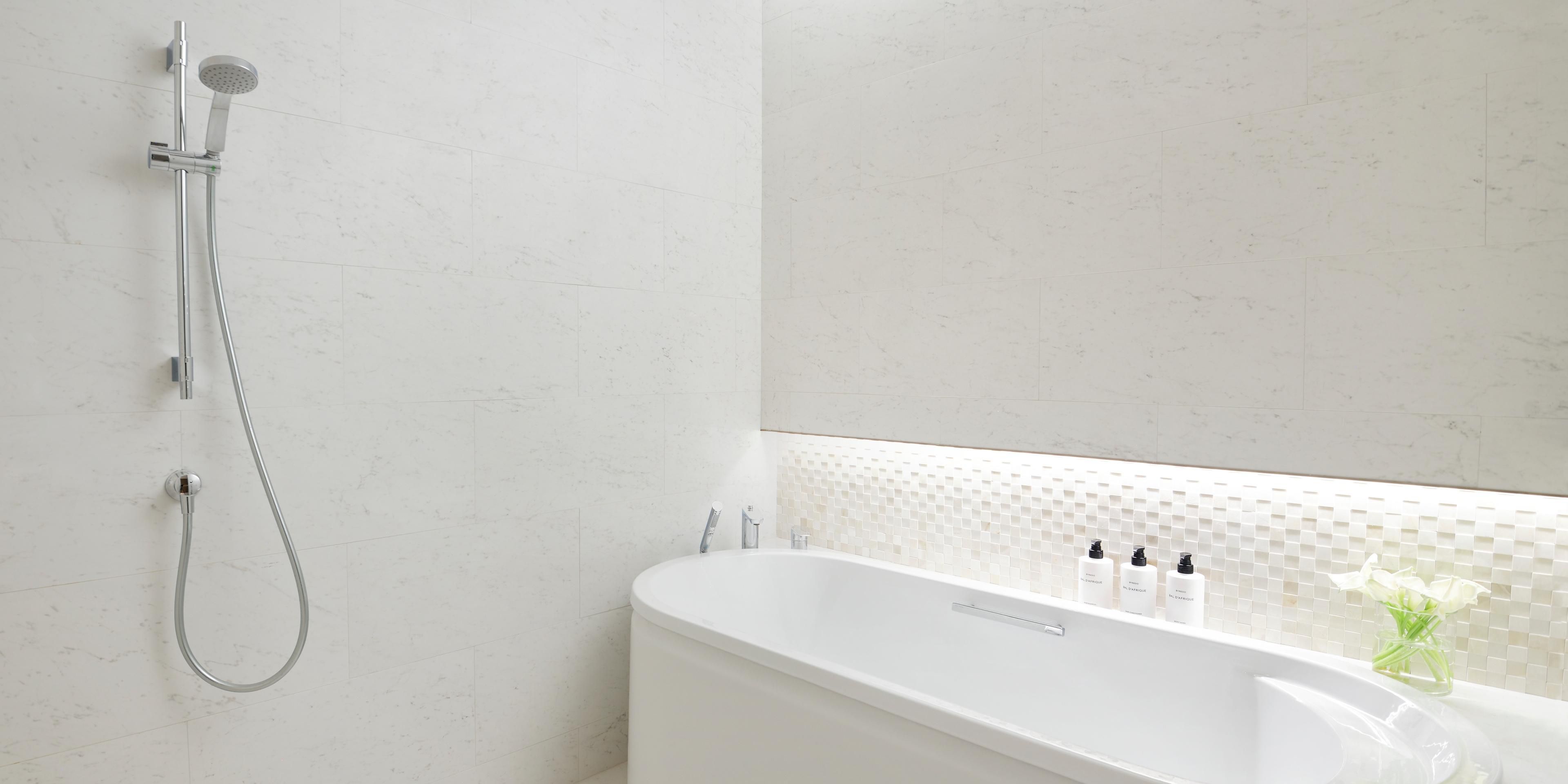 Guest Bathroom with Byredo amenities and bathtub