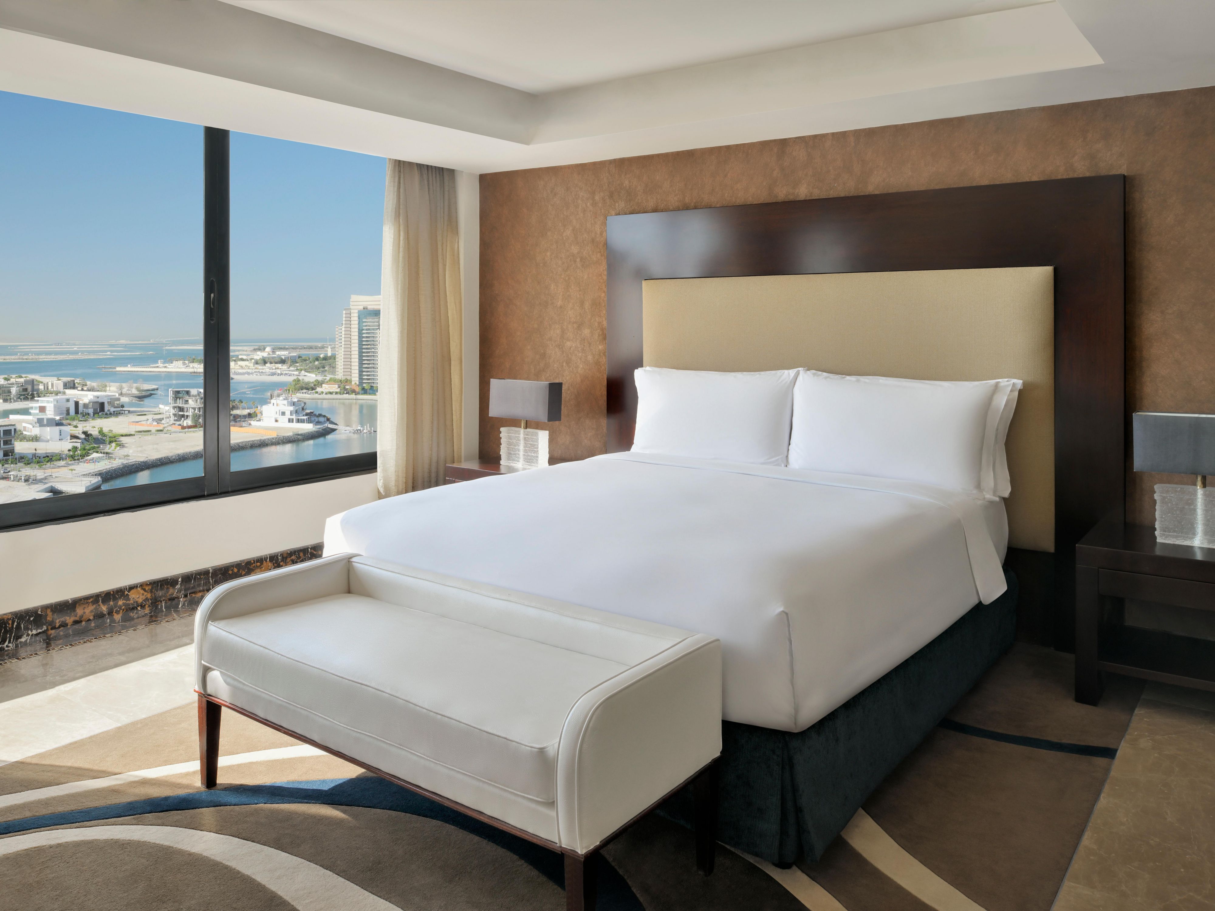 Presidential Suite bedroom with sweeping views of the sea