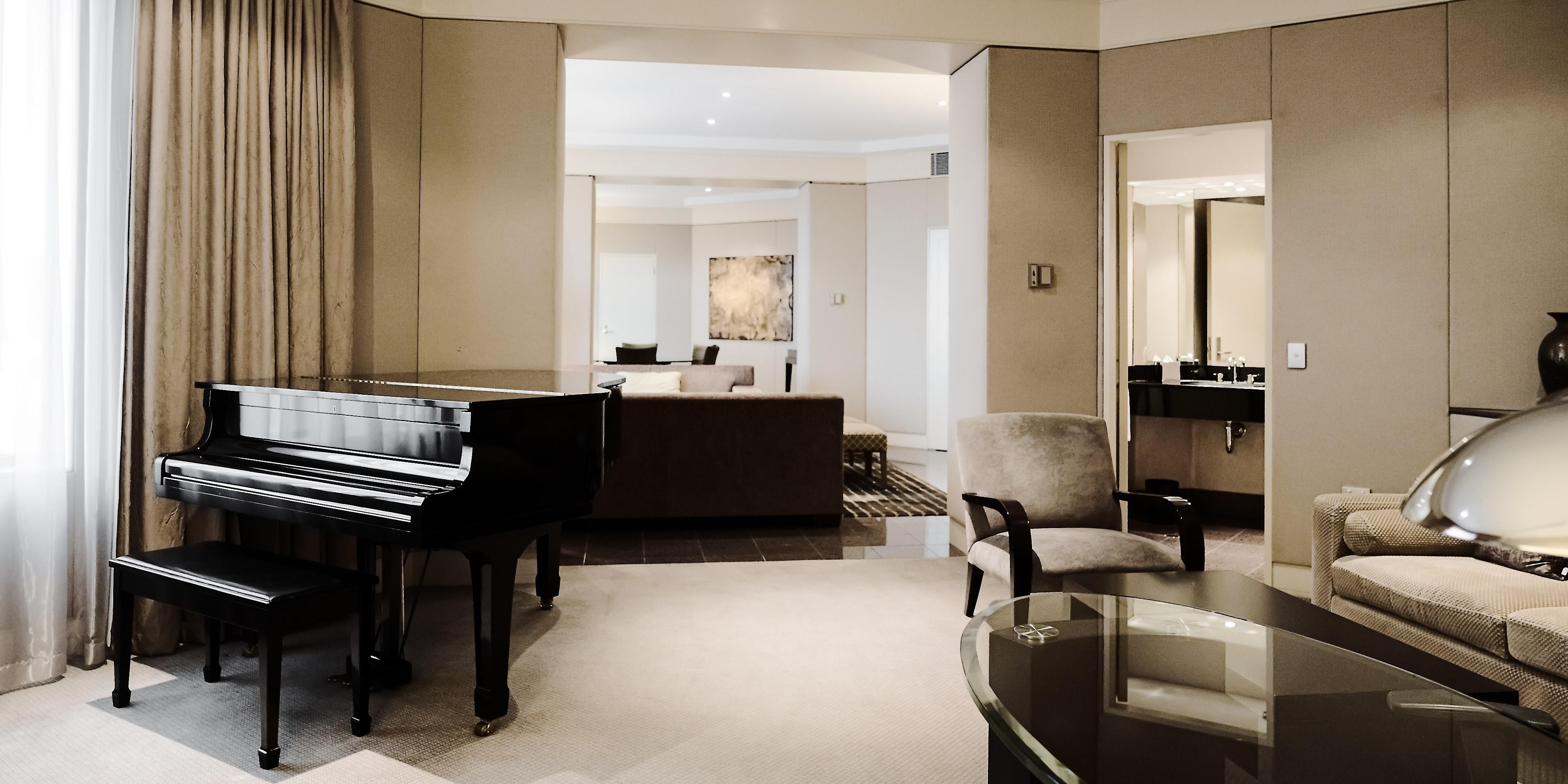 Luxurious Presidential Suite with baby grand piano in living room