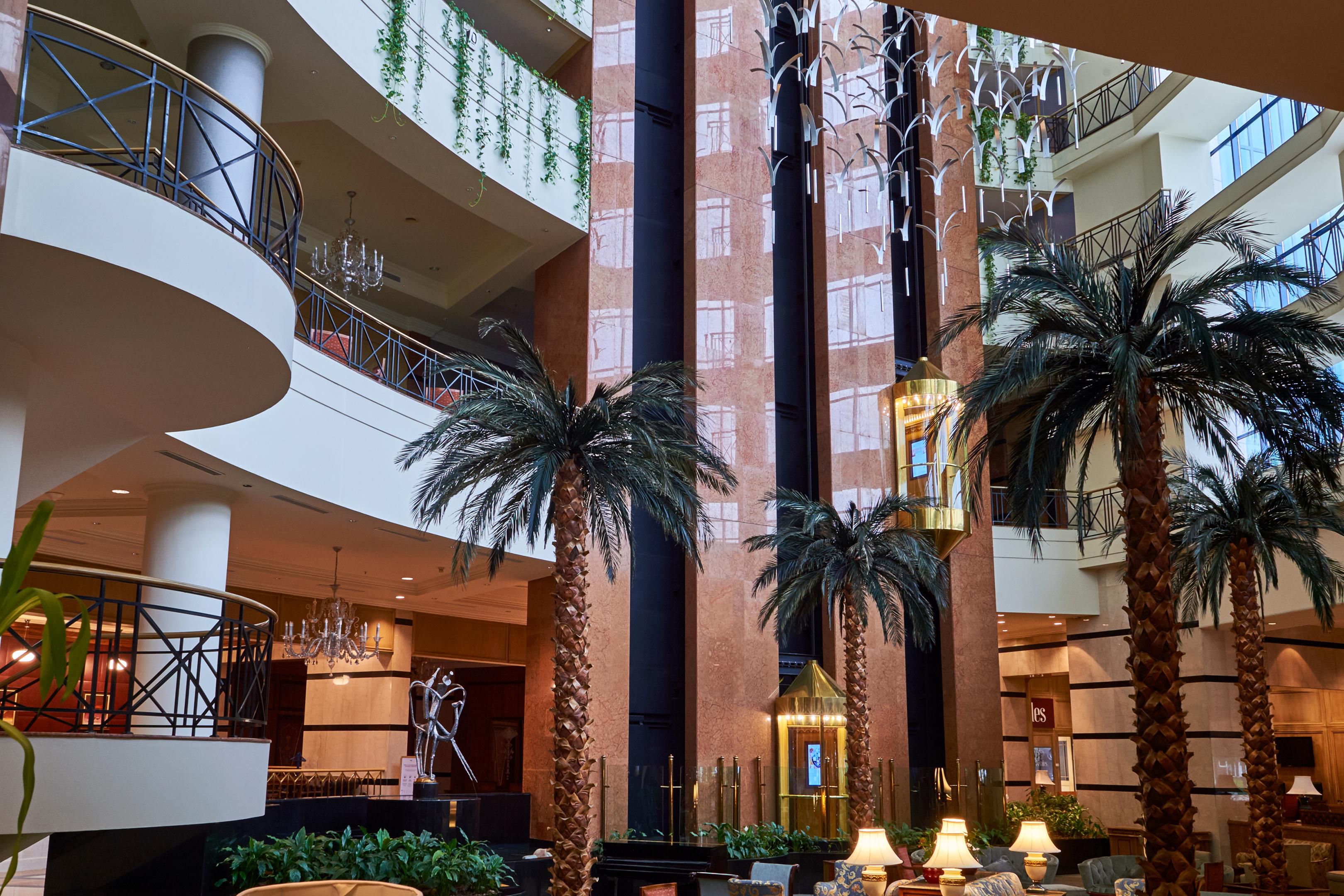 The  hotel  bar boasts a soaring white atrium at lobby