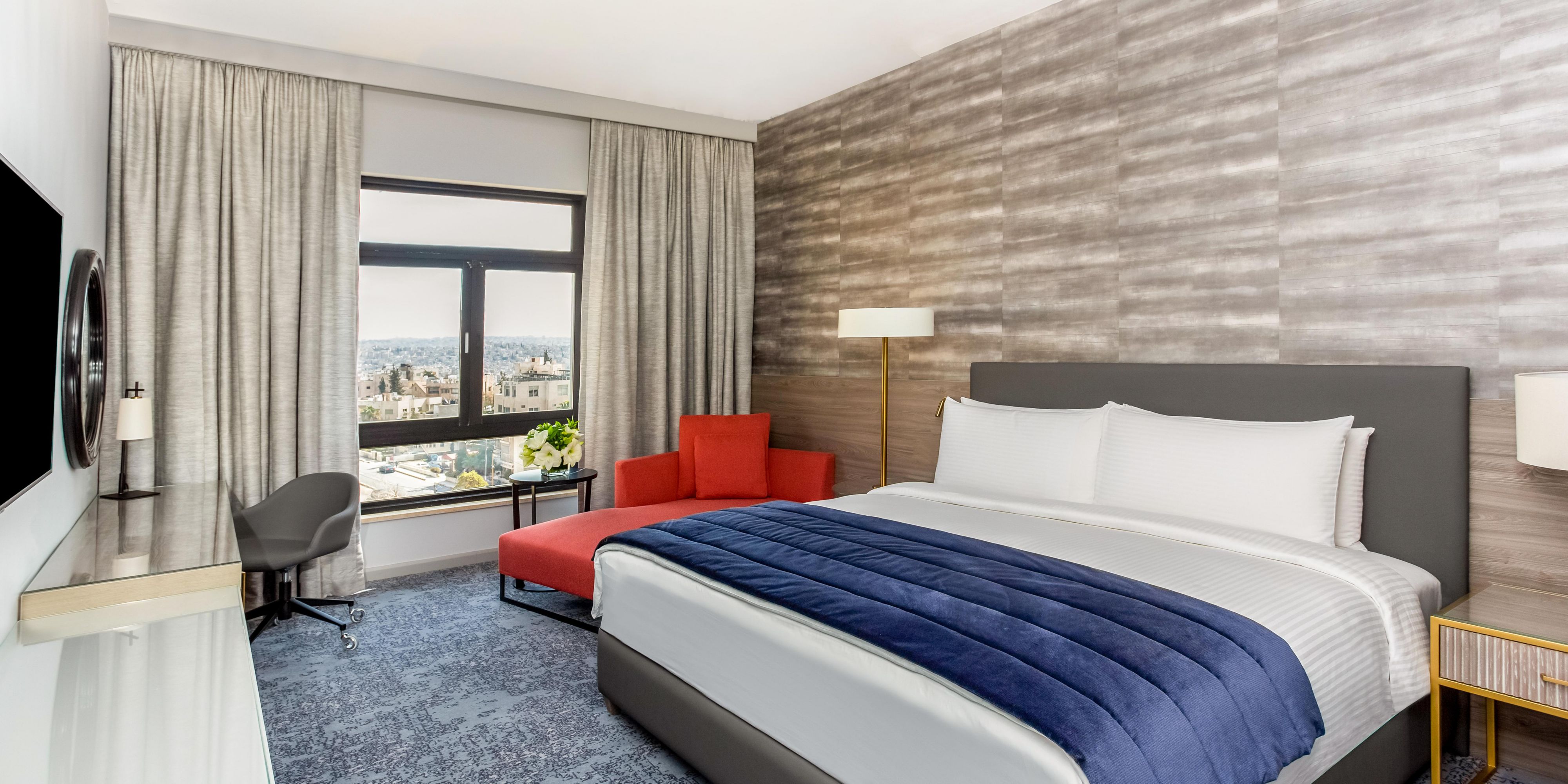Indulge in freshly renovated premium rooms, fluid in contemporary design. Enjoy unsurpassed views of the renowned hills of residential Amman. Equipped with Bluetooth soundbar and 55" Smart TV. Step into a crisp white bathroom complete with rain shower. Fitted with the very latest espresso machines and in-room amenities.