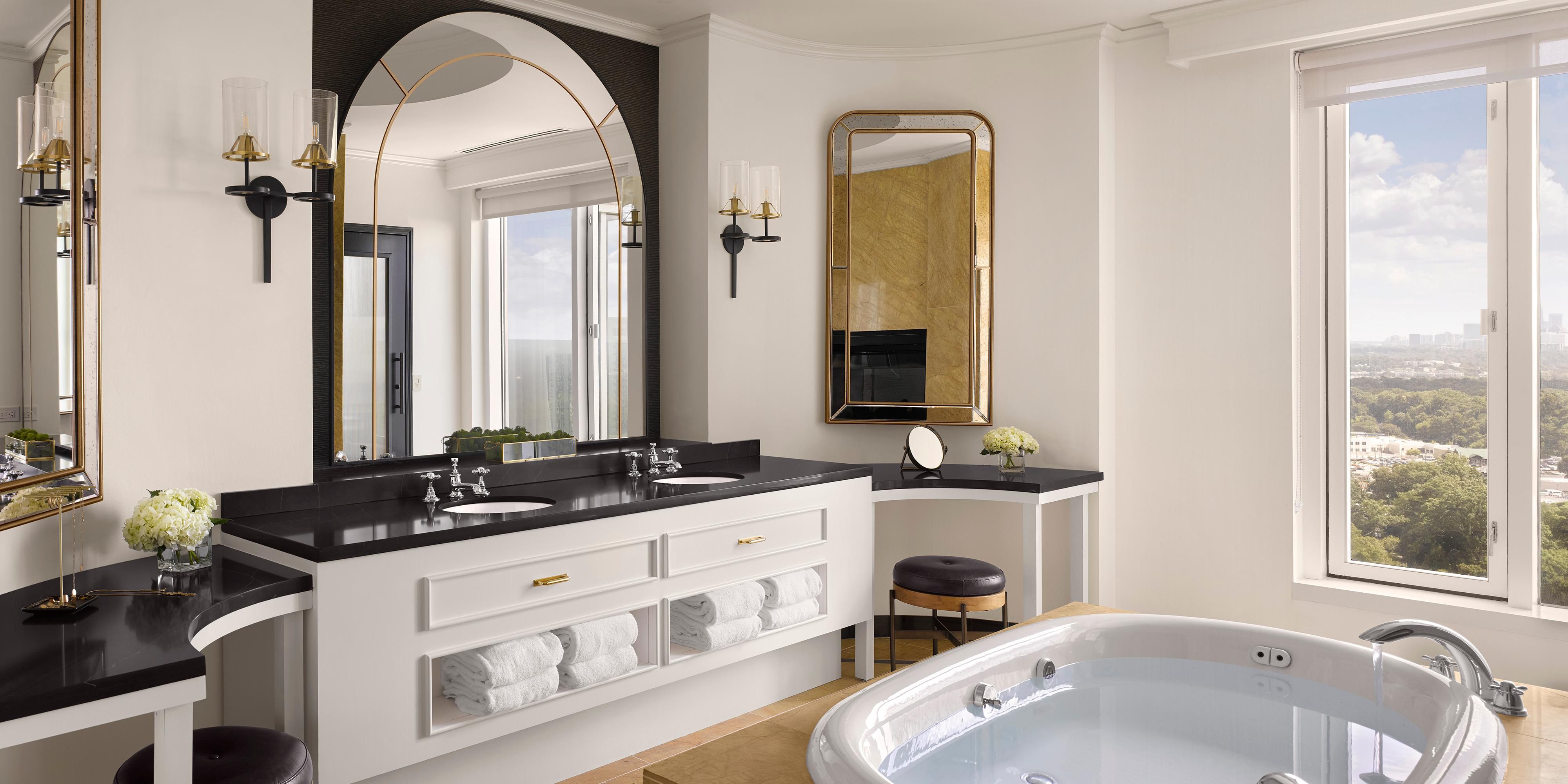 Presidential Bath. Double sinks, soaking tub and dressing tables.