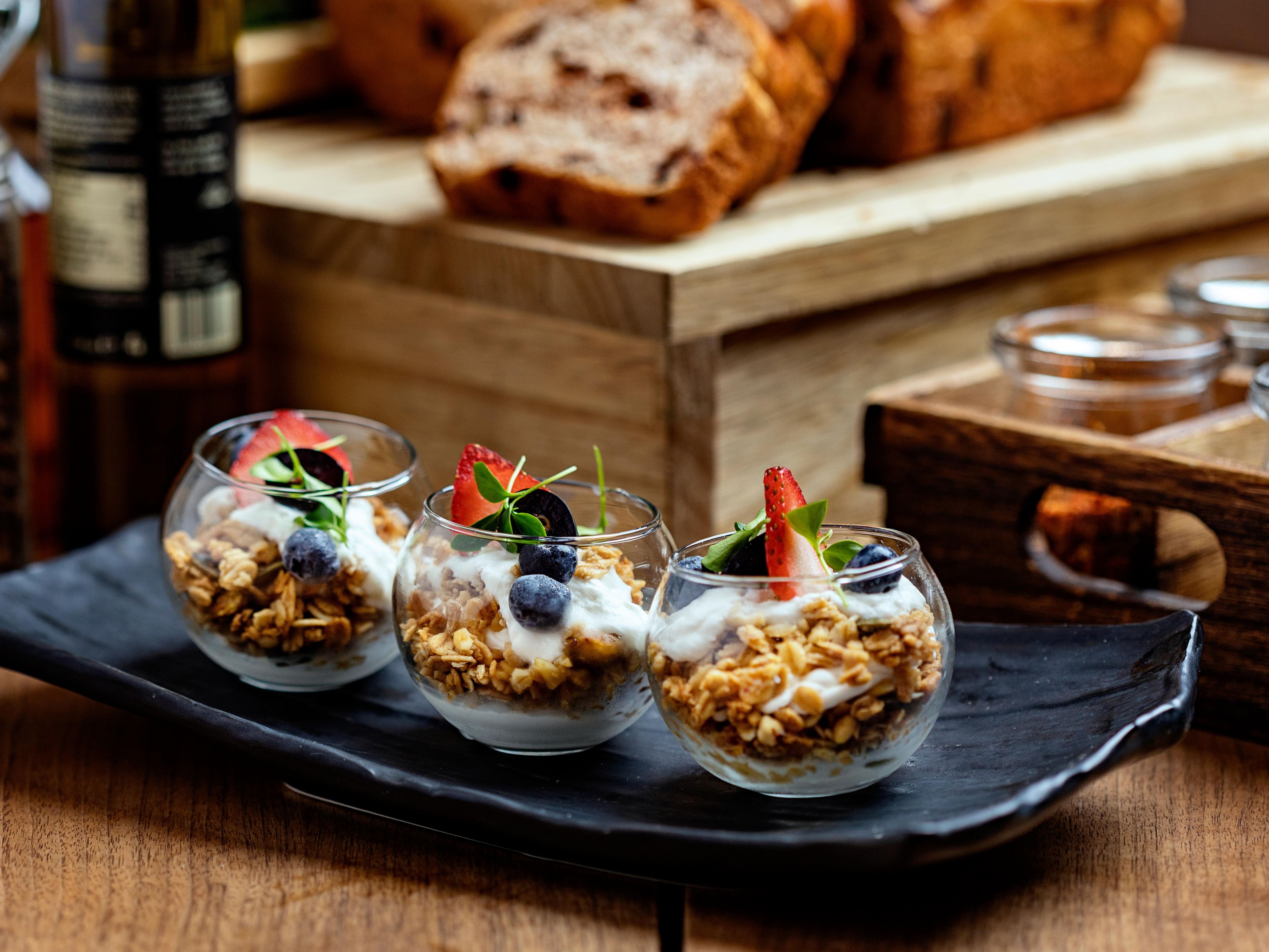 Three small bowls of yogurt parfait