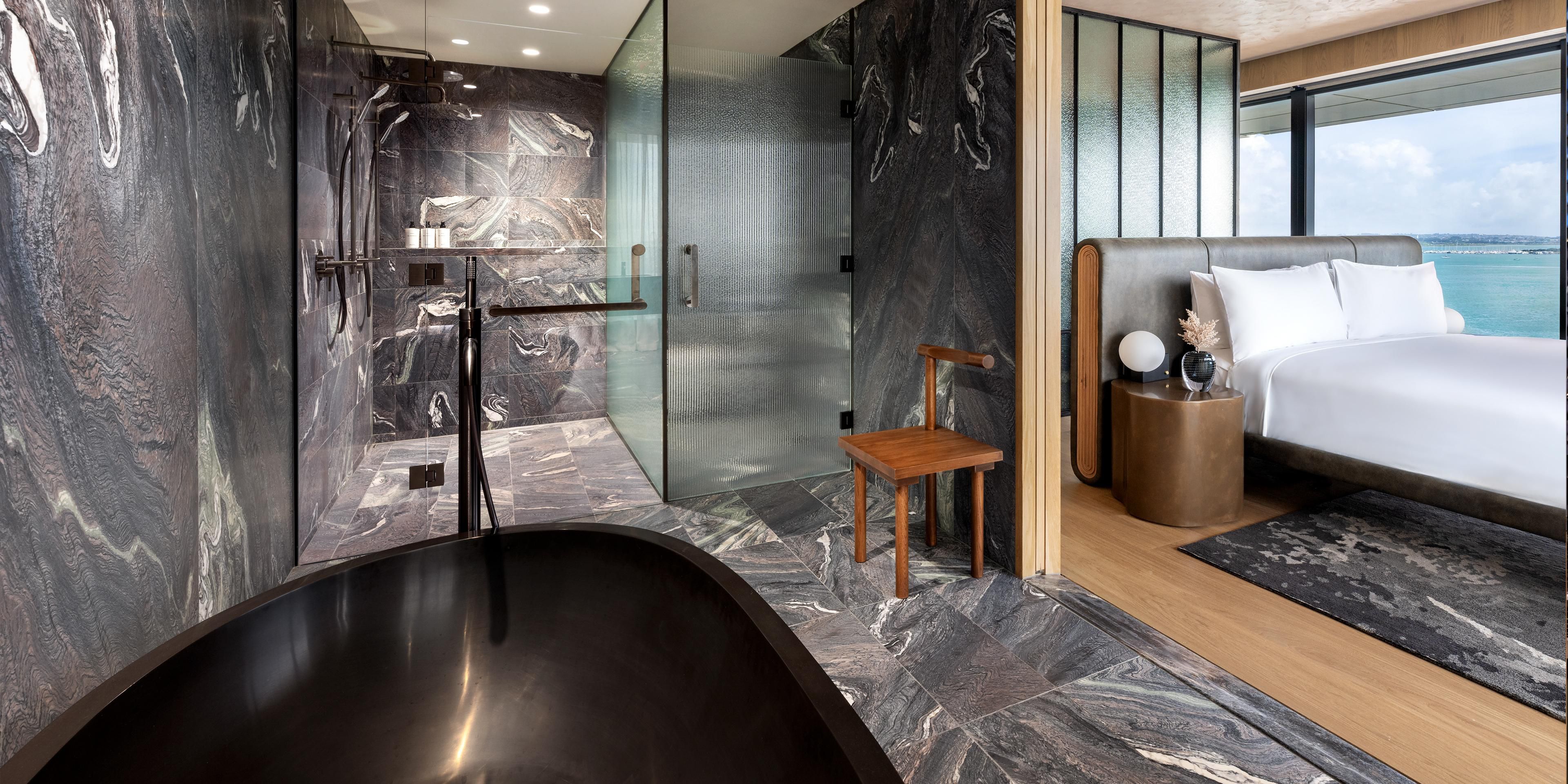 Unwind in elegance with sleek marble finishes and serene views