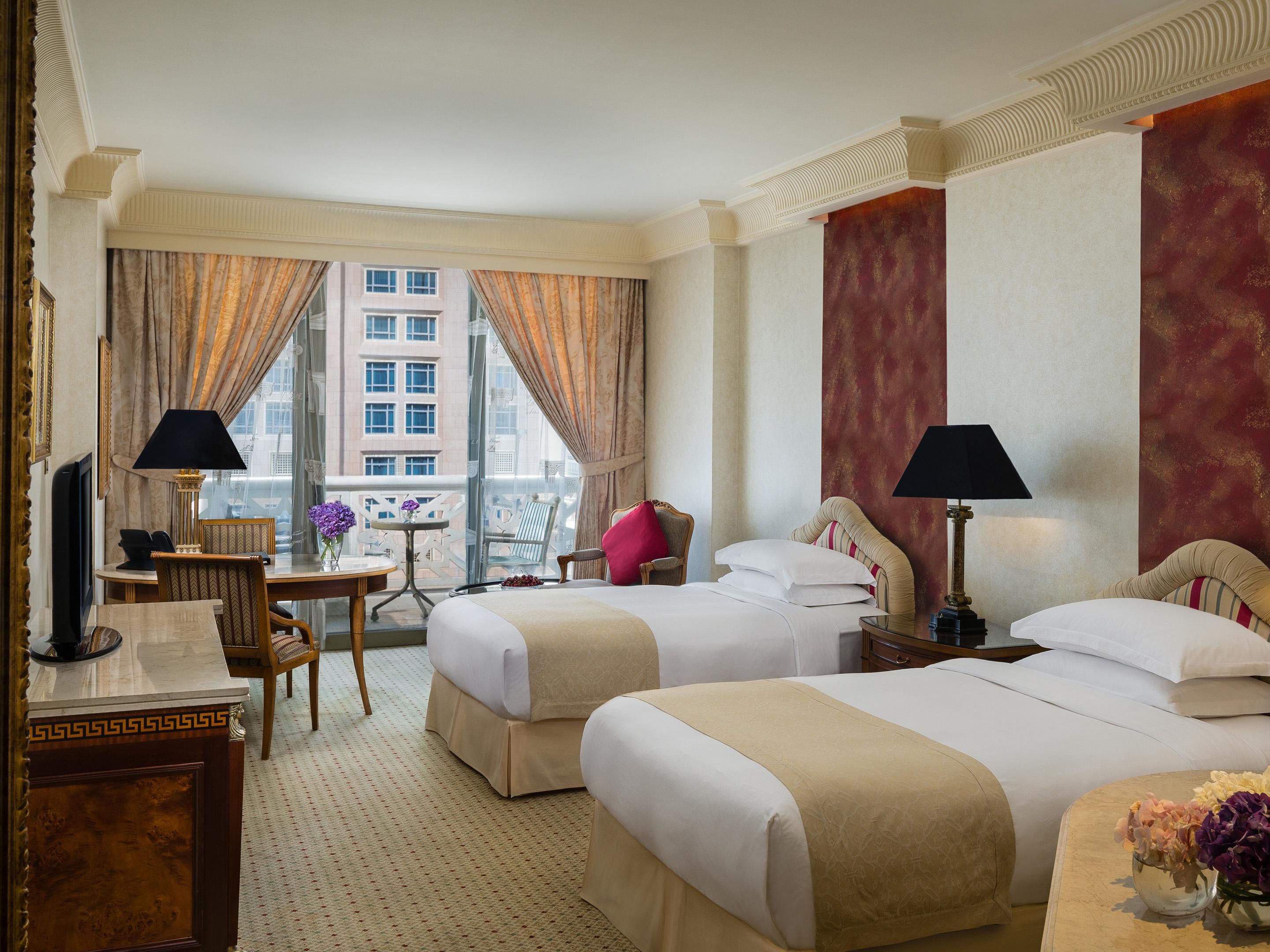 The Grand Premium twin bedroom offers a balcony with view