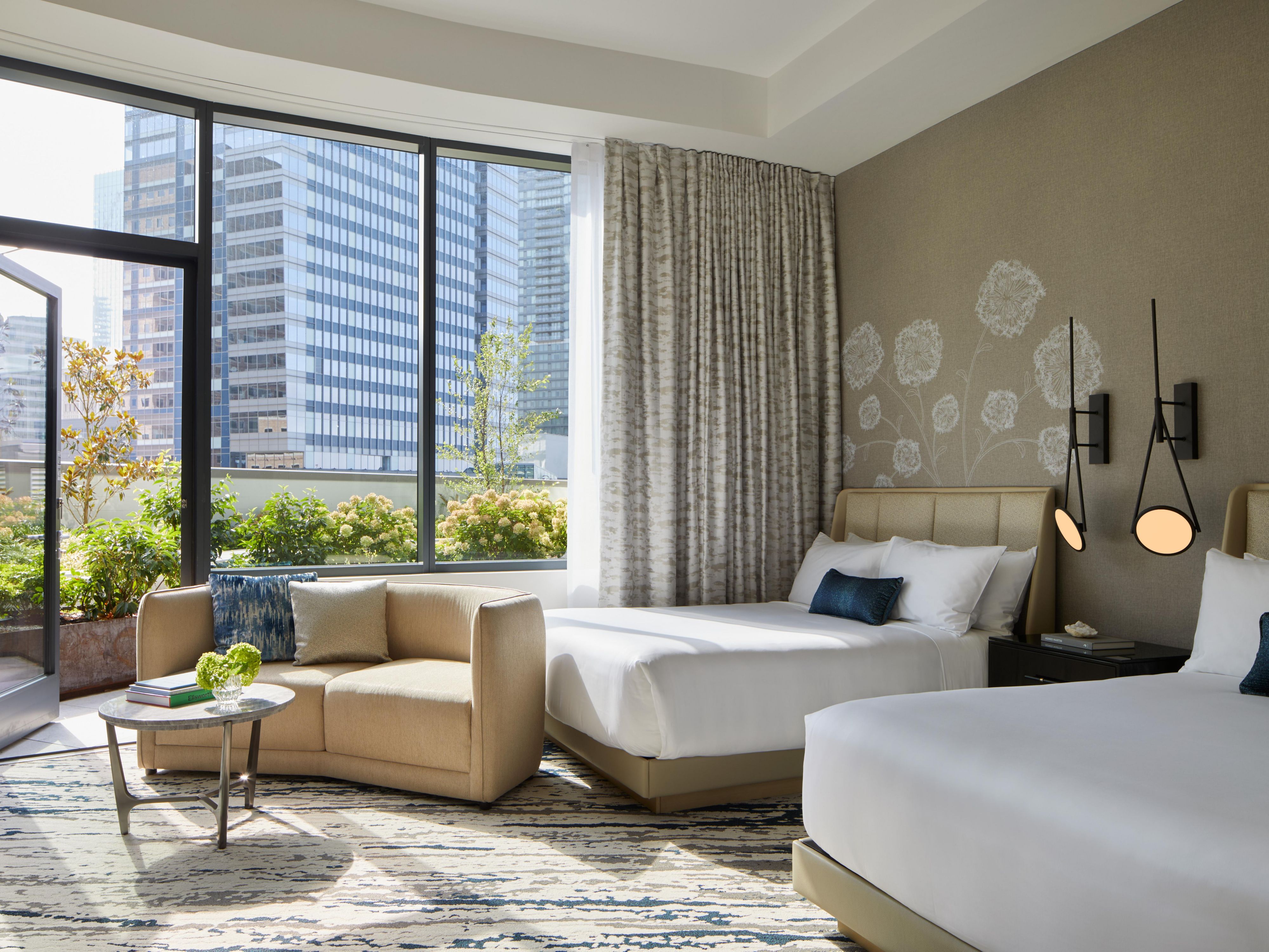 InterContinental Bellevue two queen hotel room with seating and a balcony.