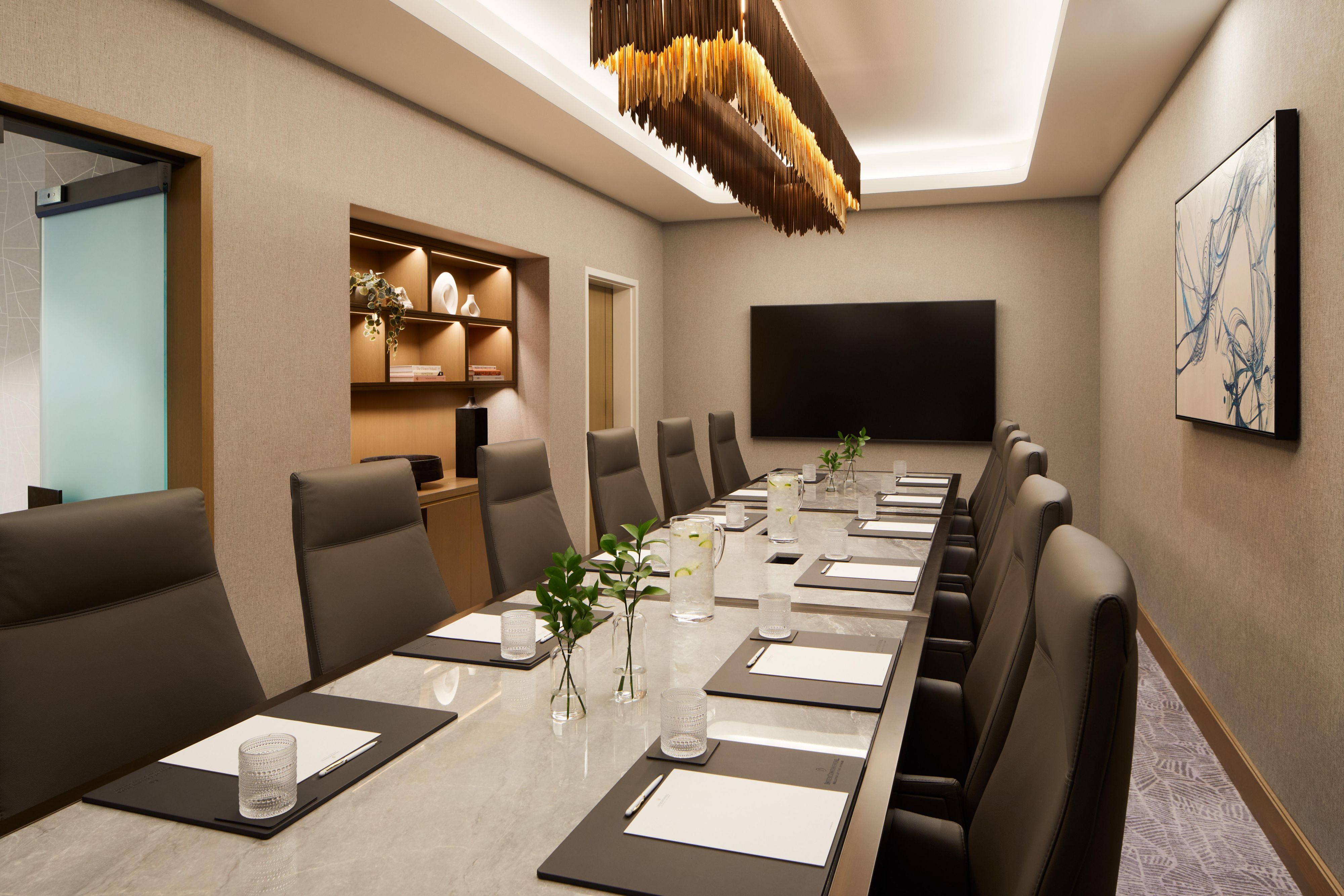 Meeting room set up with a conference table.
