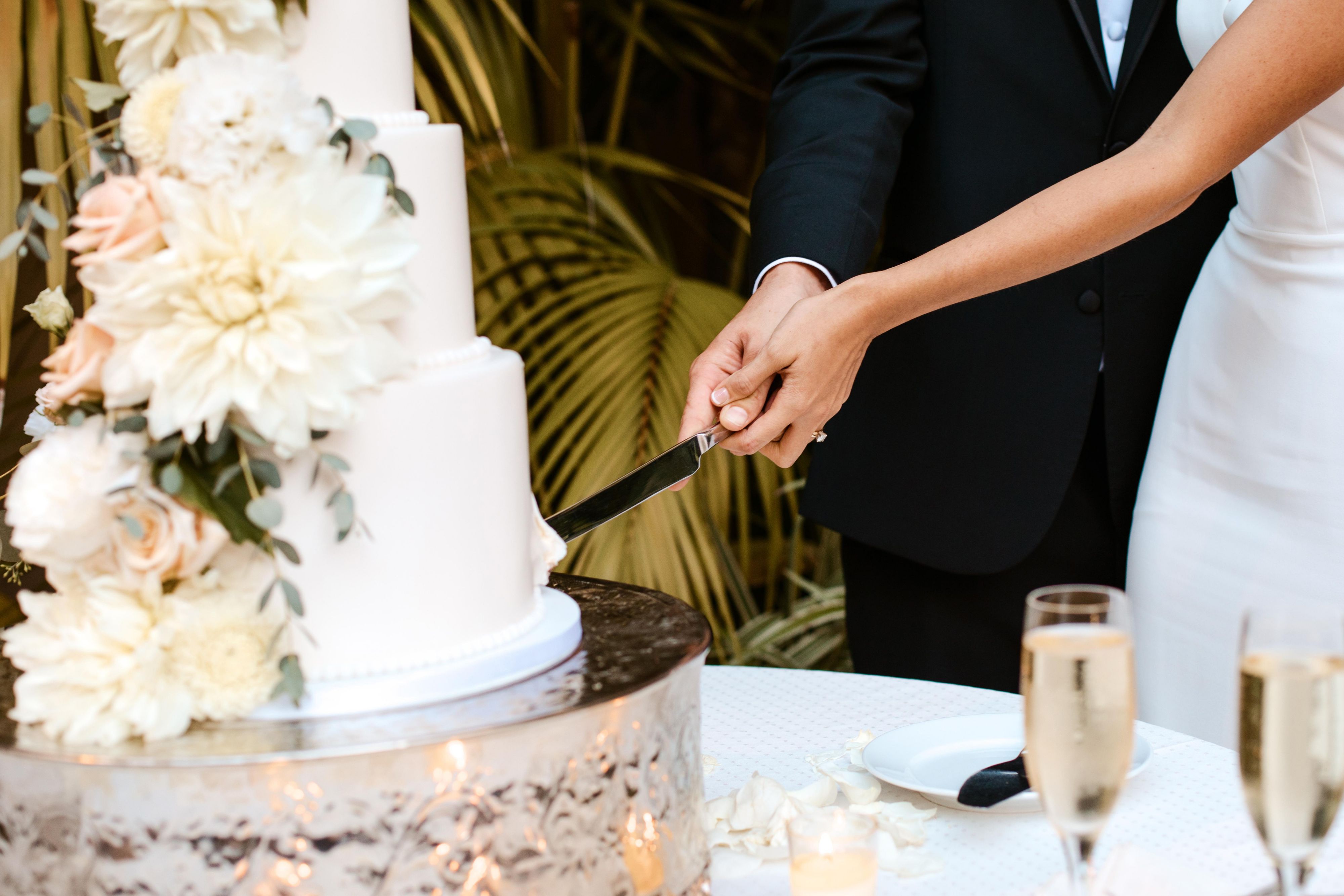 Bride and groom cutting a wedding cake.