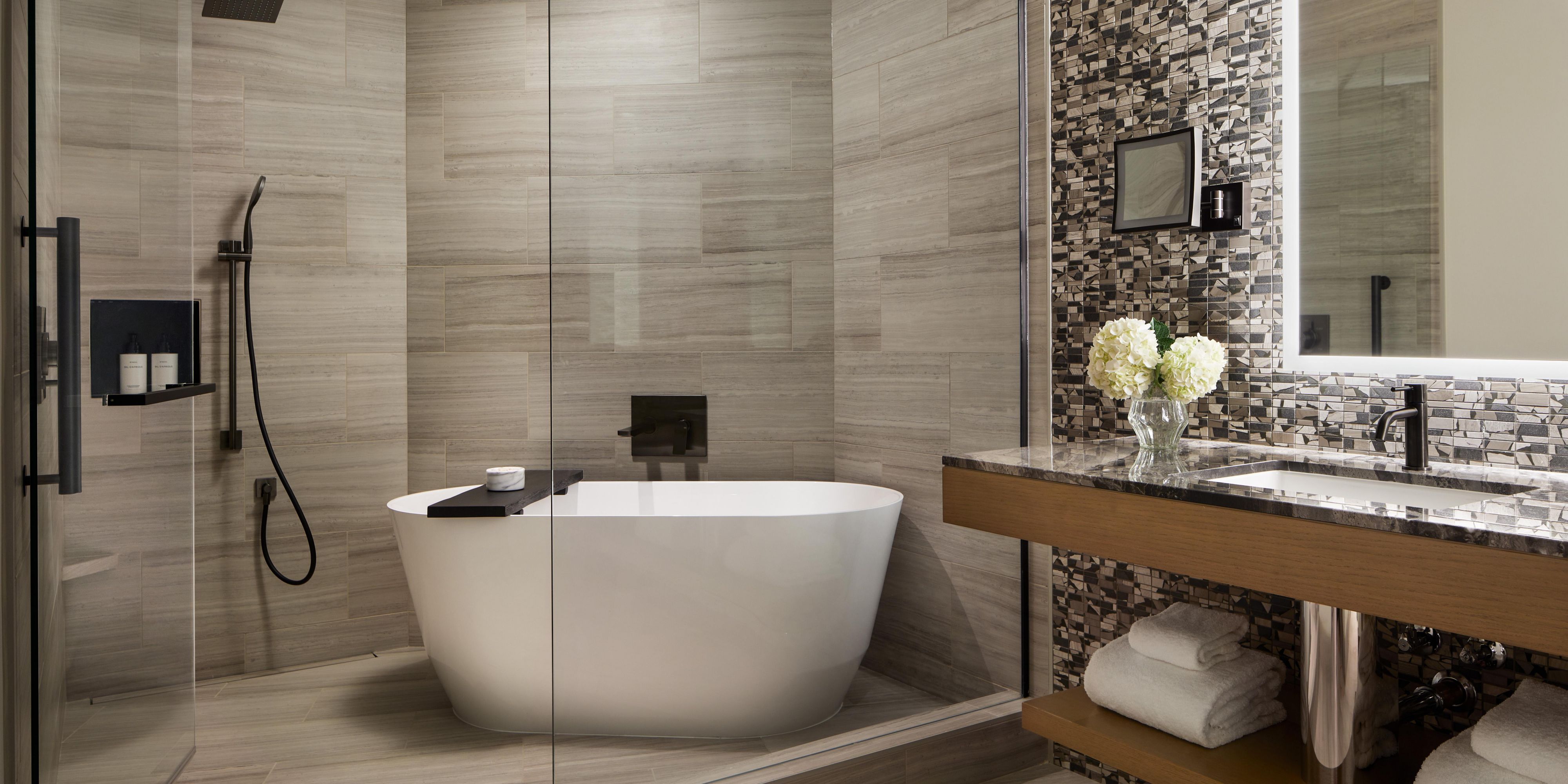 Spa-inspired bathroom with a walk-in shower, a standalone tub nestled inside.