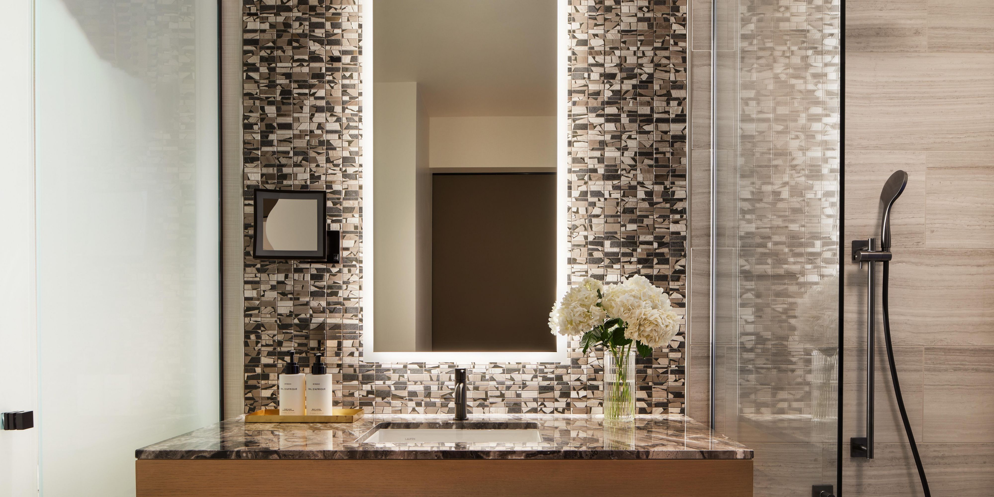 Standard bathroom with luxe marble countertop & Italian fixtures