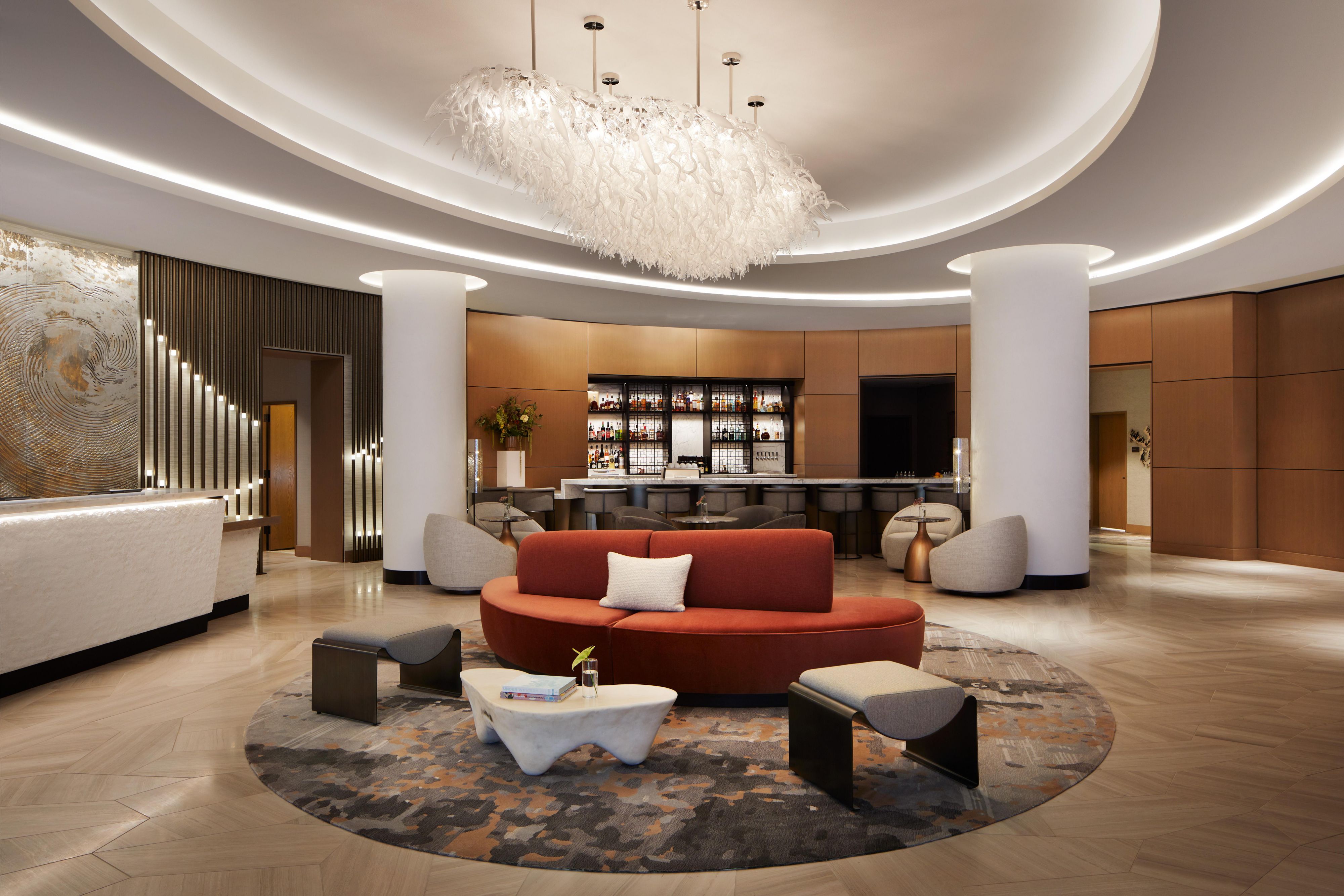 Inviting curved contours & furnishings create harmony & fluidity.