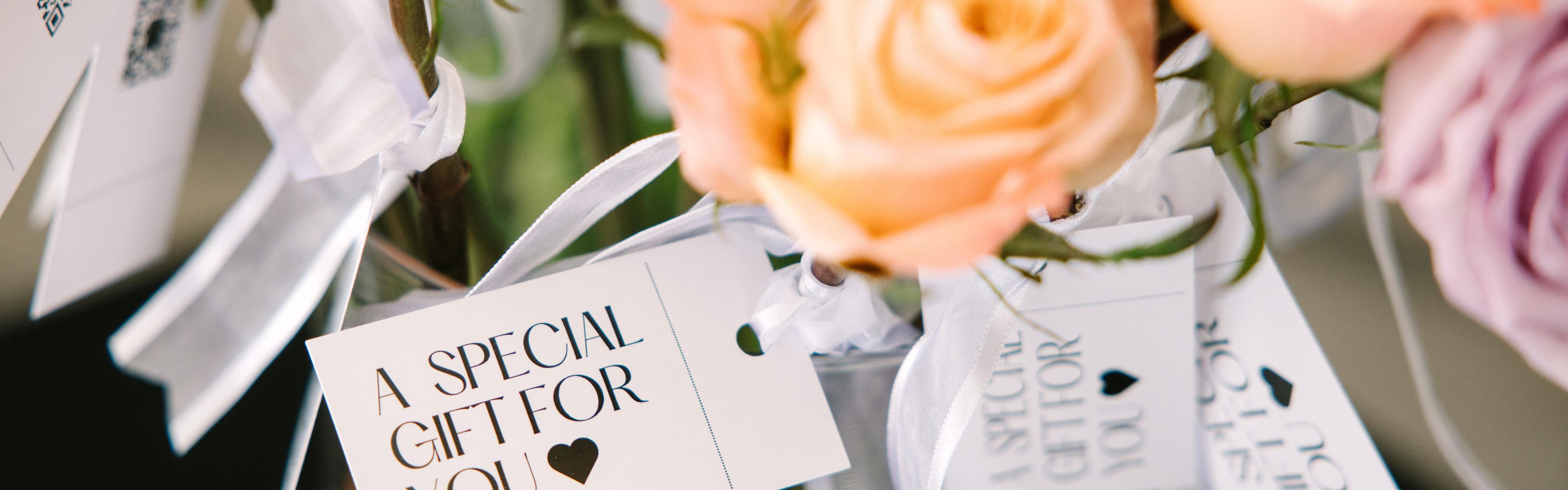Flowers with a "Special gift for you" tag.