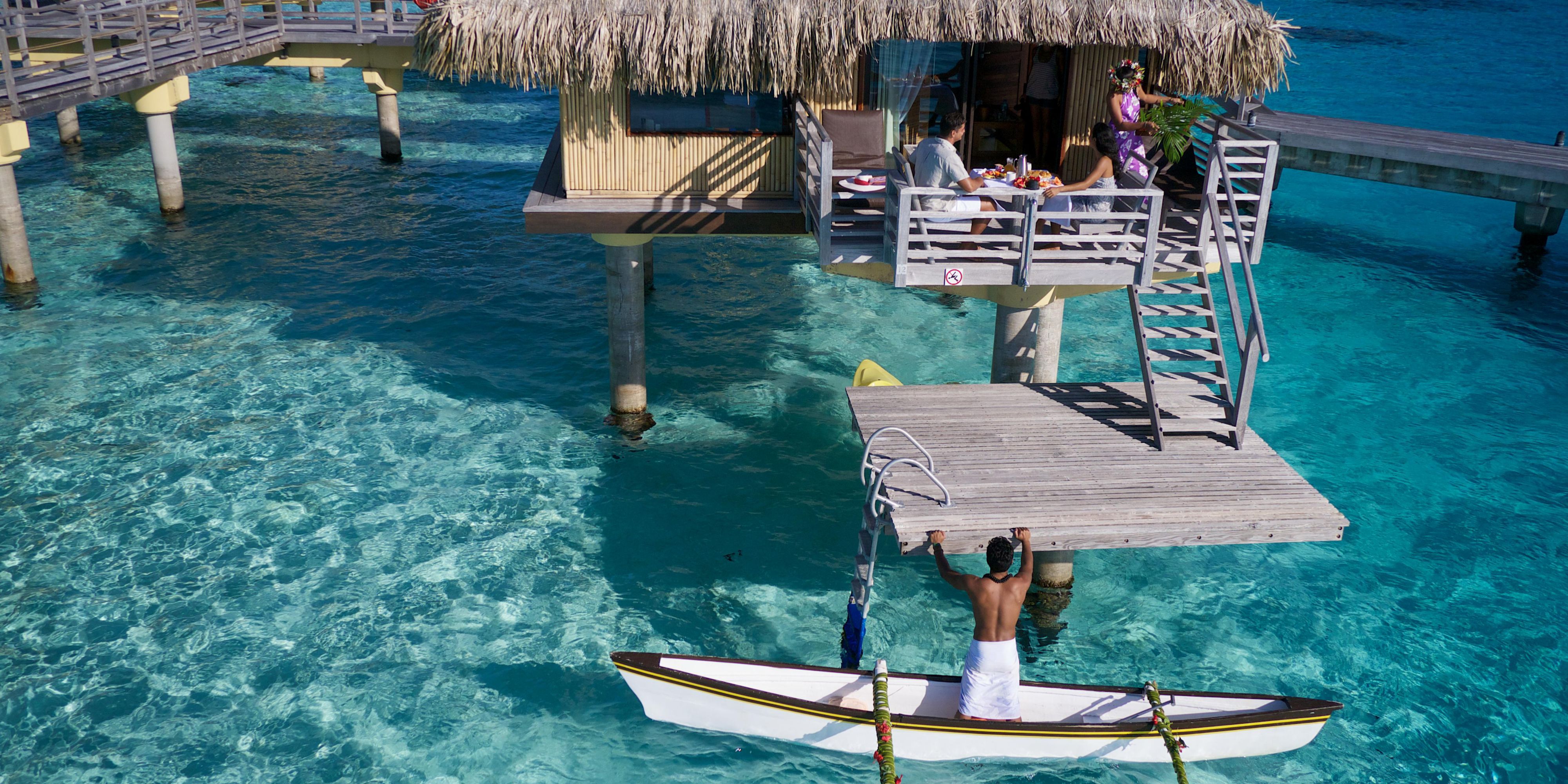 With the sound of the pu (Tahitian for “conch shell"), the dreamiest breakfast in French Polynesia begins Couples can watch their morning meal being delivered across the turquoise lagoon on a traditional outrigger canoe, which pulls right up to their overwater bungalow.