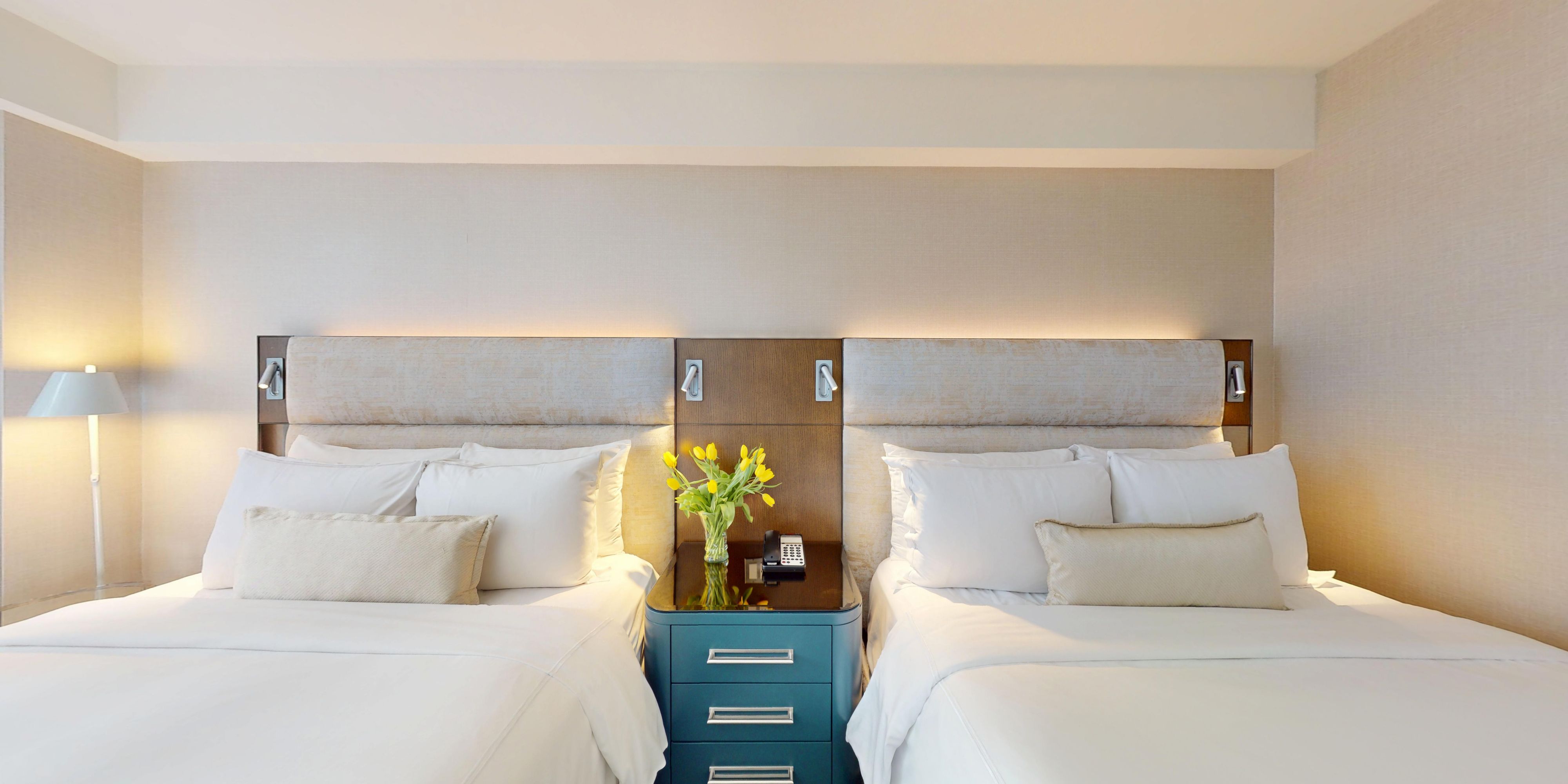 Spacious two queen guest room with contemporary design