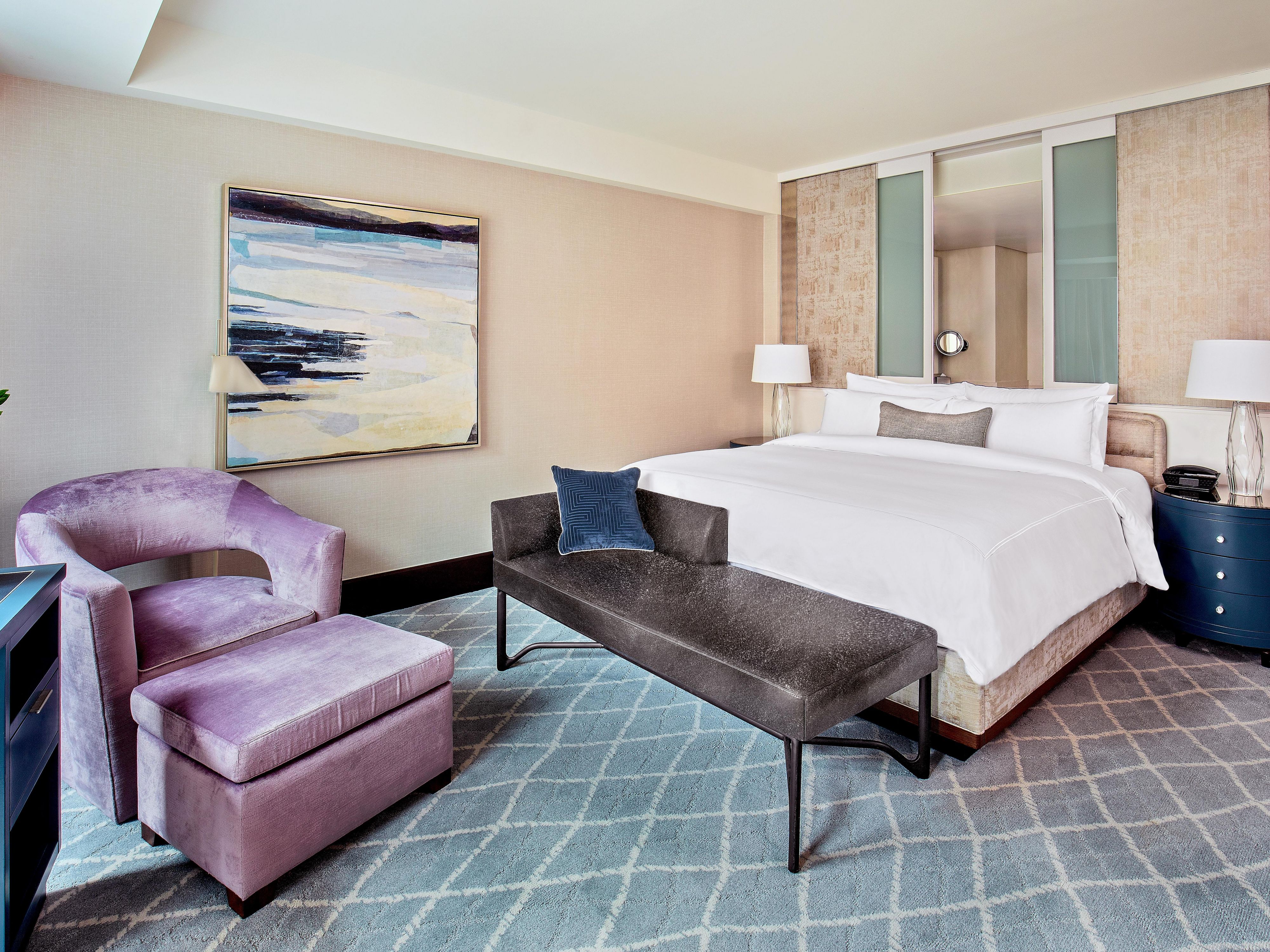 Elegantly furnished king room with a spacious bath