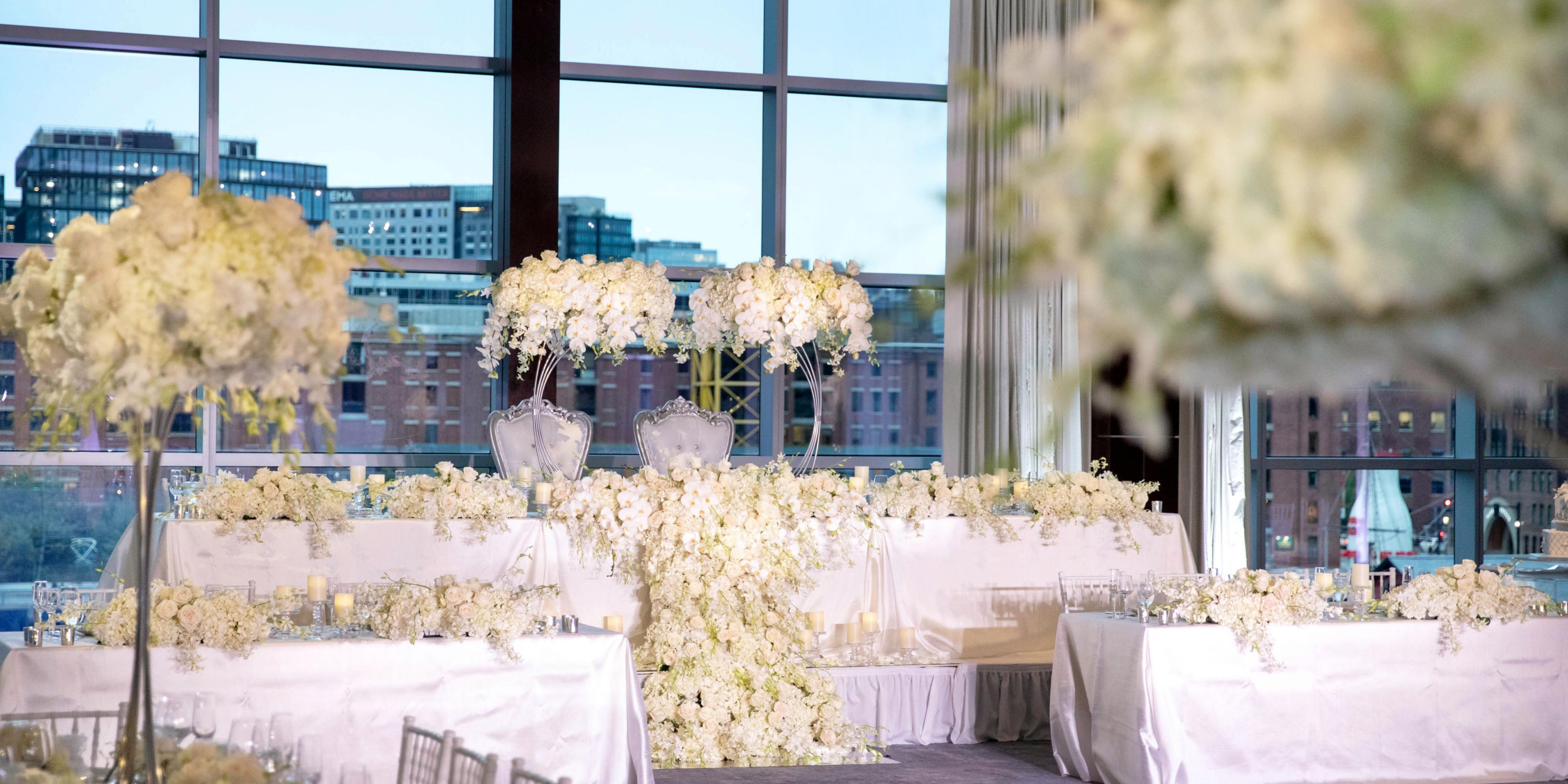 Host your wedding in our luxurious venue with romantic views of the Boston waterfront. Our hotel offers beautiful event spaces, including the Abigail Adams Ballroom and Rose Kennedy Ballroom, with floor-to-ceiling windows overlooking Fort Point Channel and the Seaport District. Our team will assist with the details to make your event unforgettable.