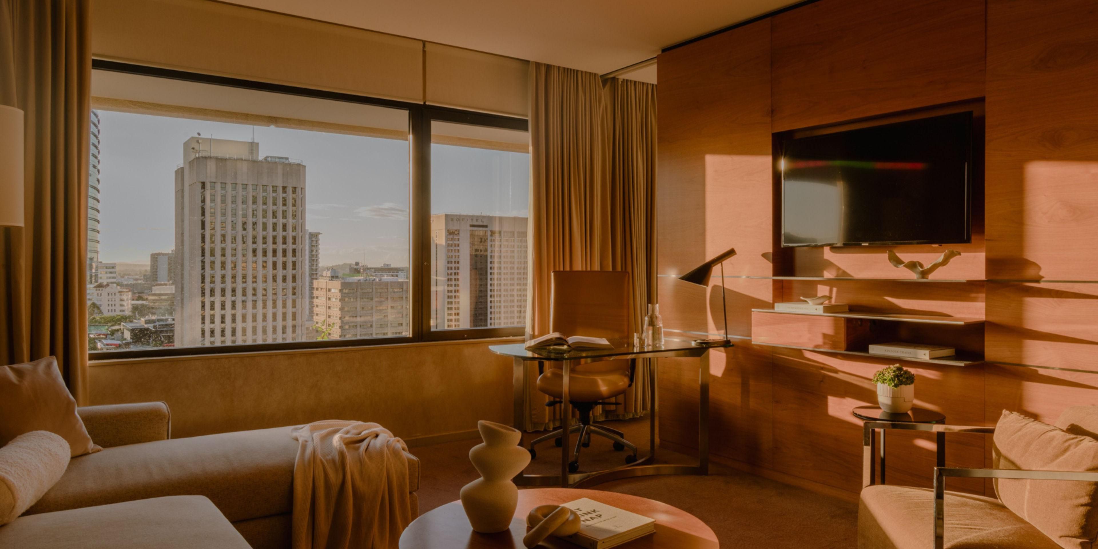 Suite lounge and work space with city views