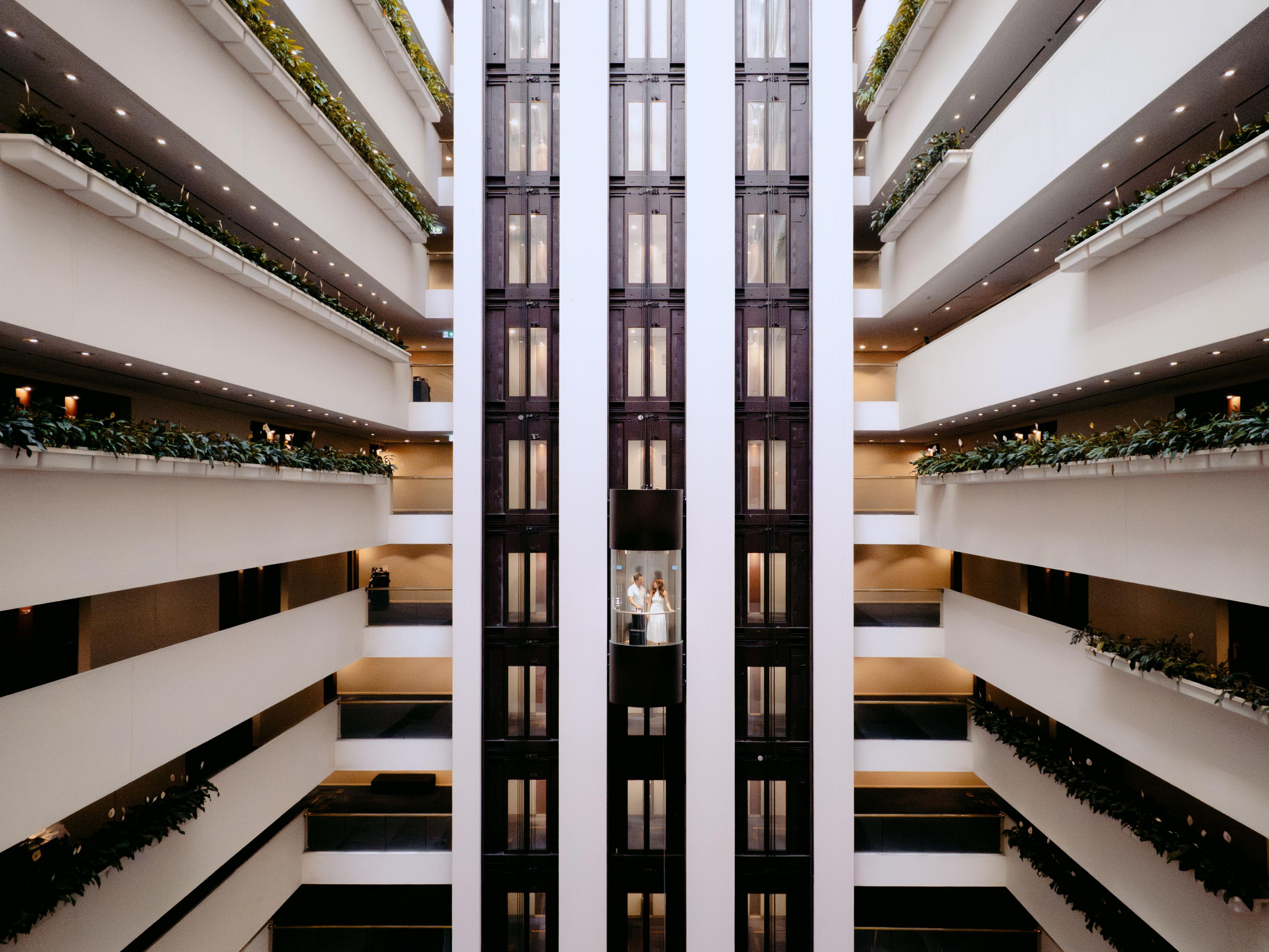 The view of the atrium and lift capsules from the hotel lobby