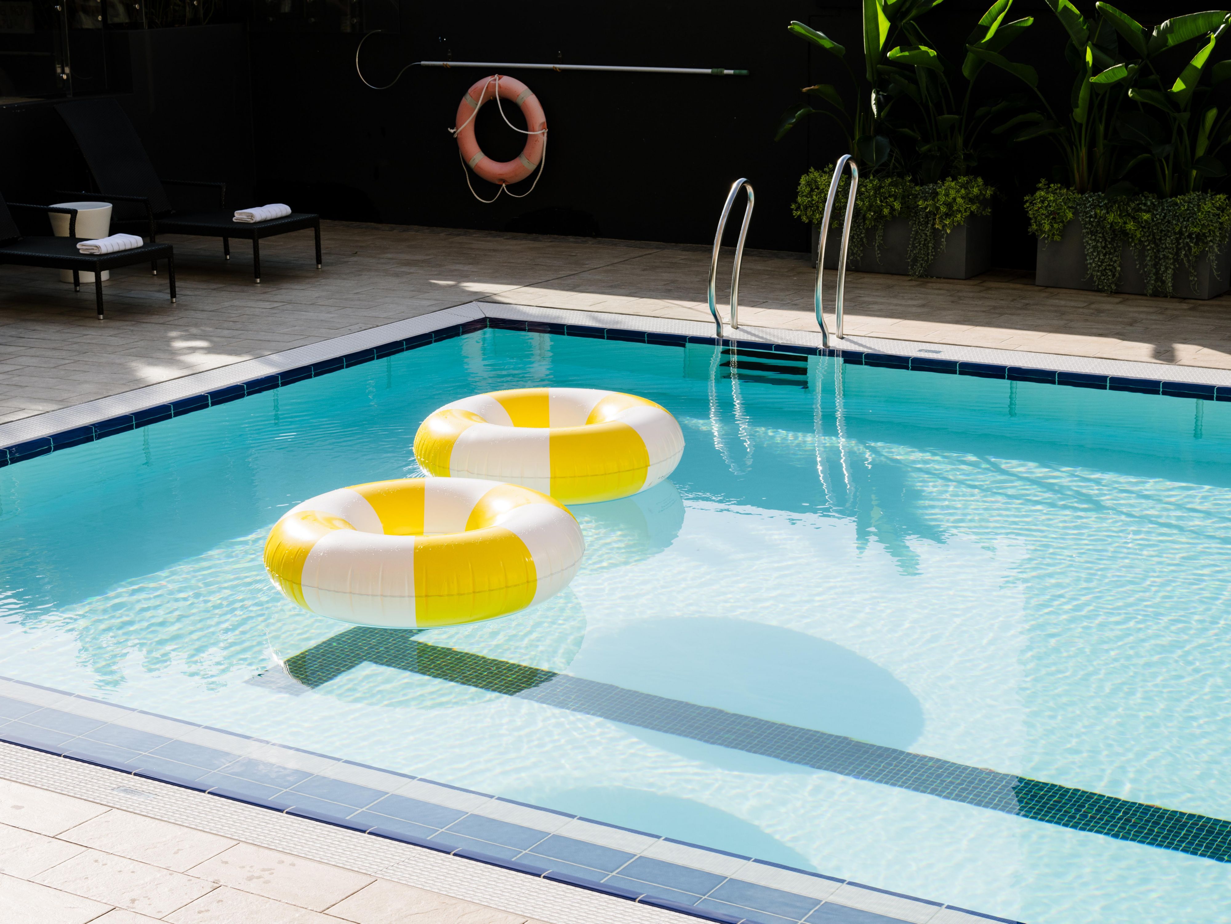 Unwind by the Swimming Pool with Sweeping Brisbane Skyline Views