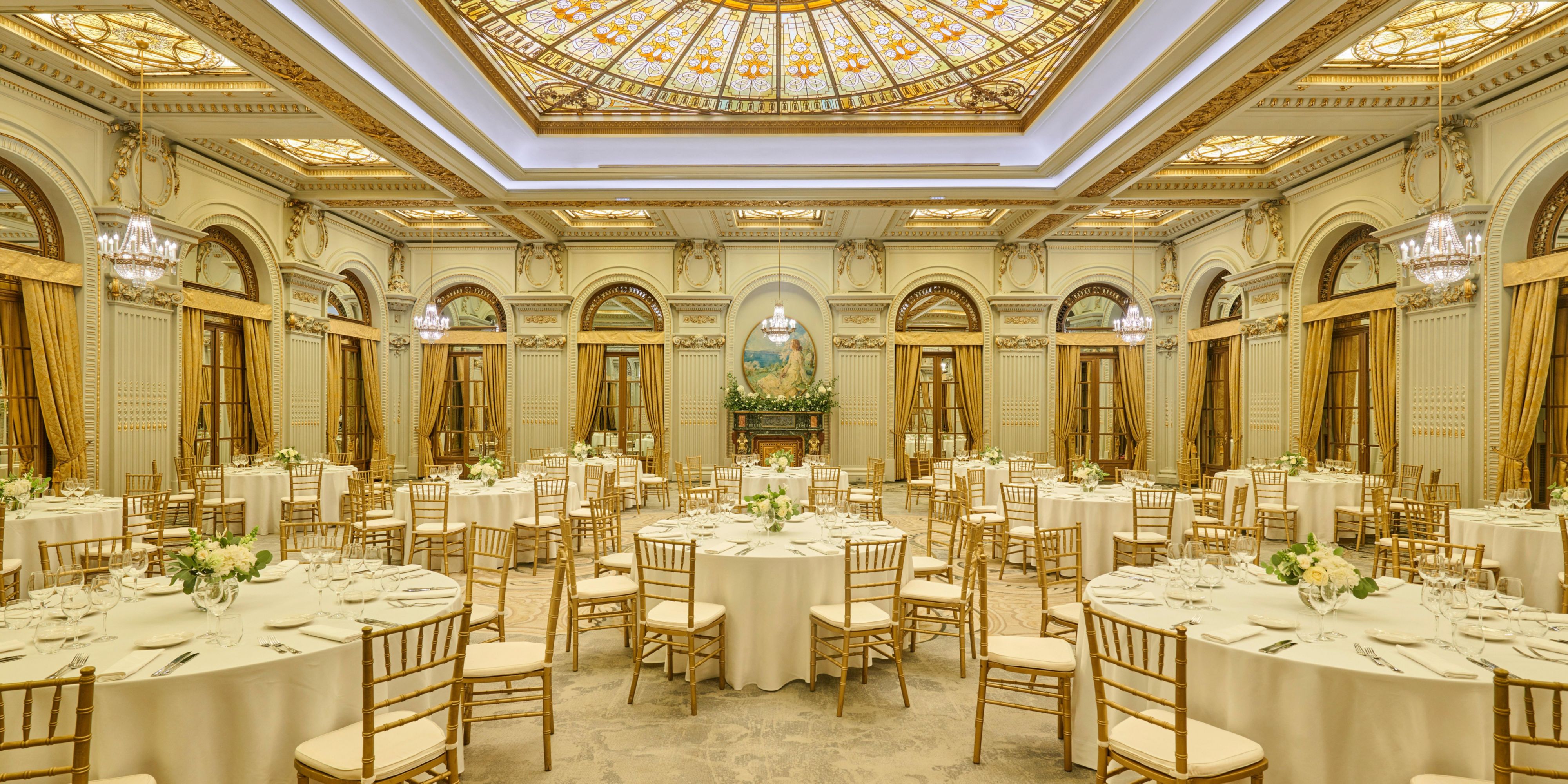 Experience grandeur at Le Diplomate Ballroom, a nationally recognized historical monument. Immerse yourself in its architectural splendor, adorned with golden leaf accents and a stunning stained glass ceiling—a truly enchanting venue for your memorable day.