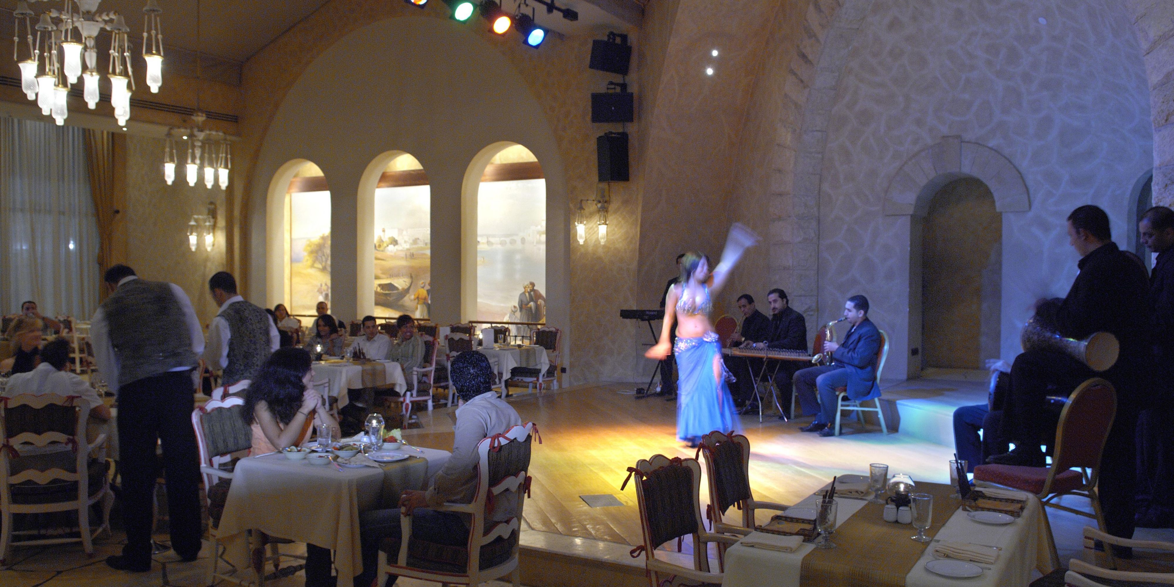 Fayruz Restaurant offers a unique dining experience with authentic Lebanese cuisine, set in an elegant atmosphere. Enjoy a diverse menu of traditional dishes prepared with fresh ingredients. Every evening, indulge in captivating live entertainment, featuring a talented belly dancer, adding a touch of magic to your meal.