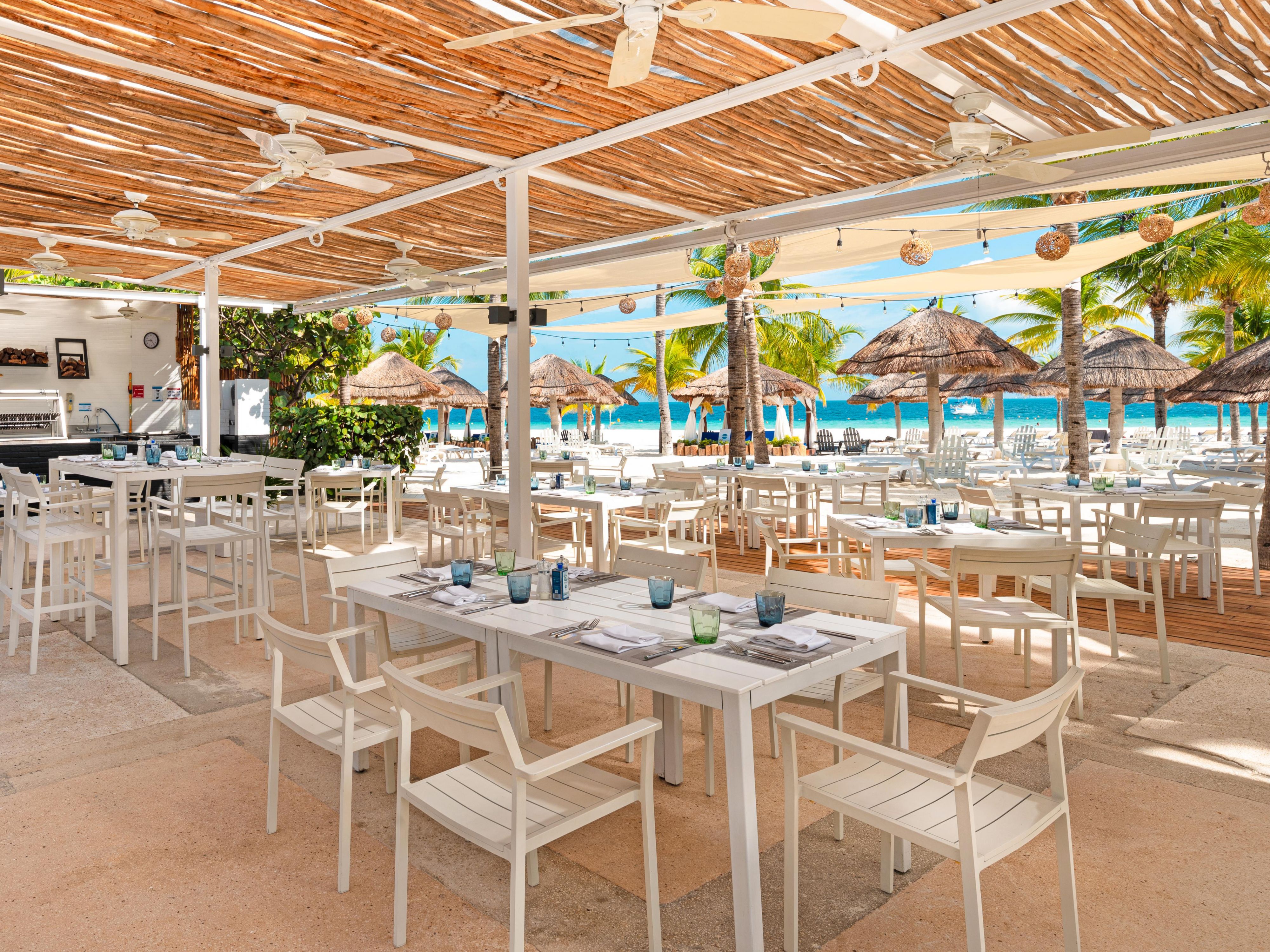 Listen to the waves while you eat at Le Cap Beach Club.